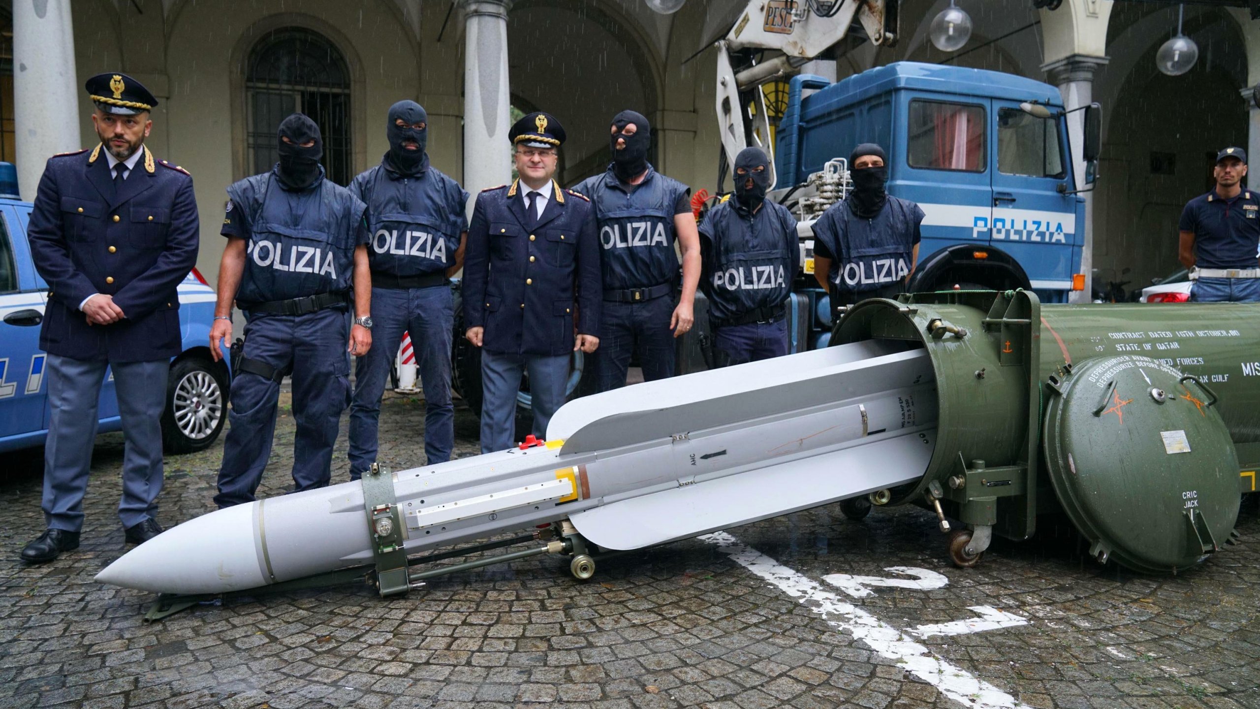 Italian police have seized "an arsenal of military weapons," including an air-to-air missile, and Nazi paraphernalia from three men, one a former political candidate for an extreme right party. (Credit: Tino Romano/AP)