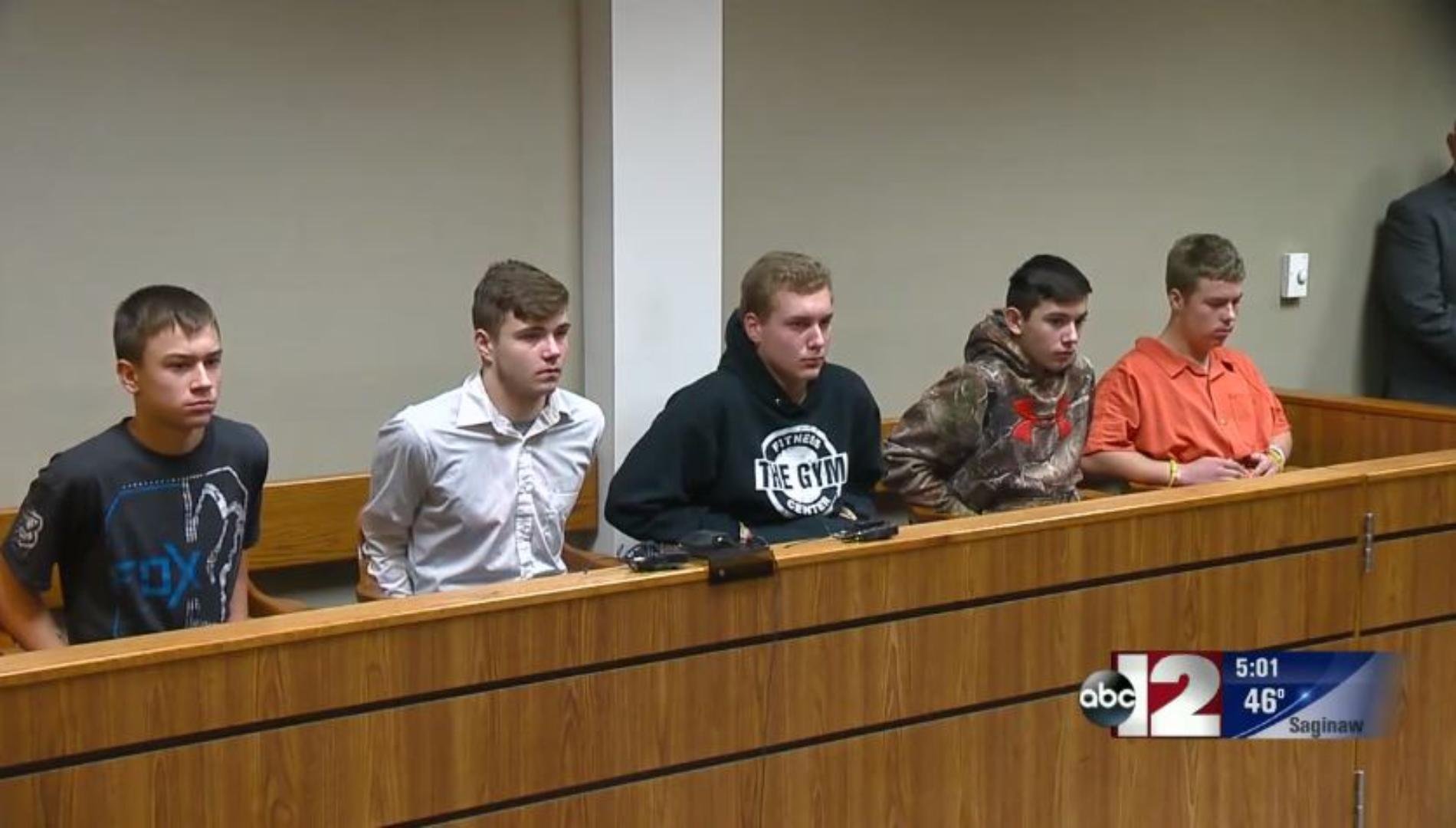 The Michigan teens who pleaded guilty to throwing a rock off a highway overpass are seen in court. (Credit: WJRT)