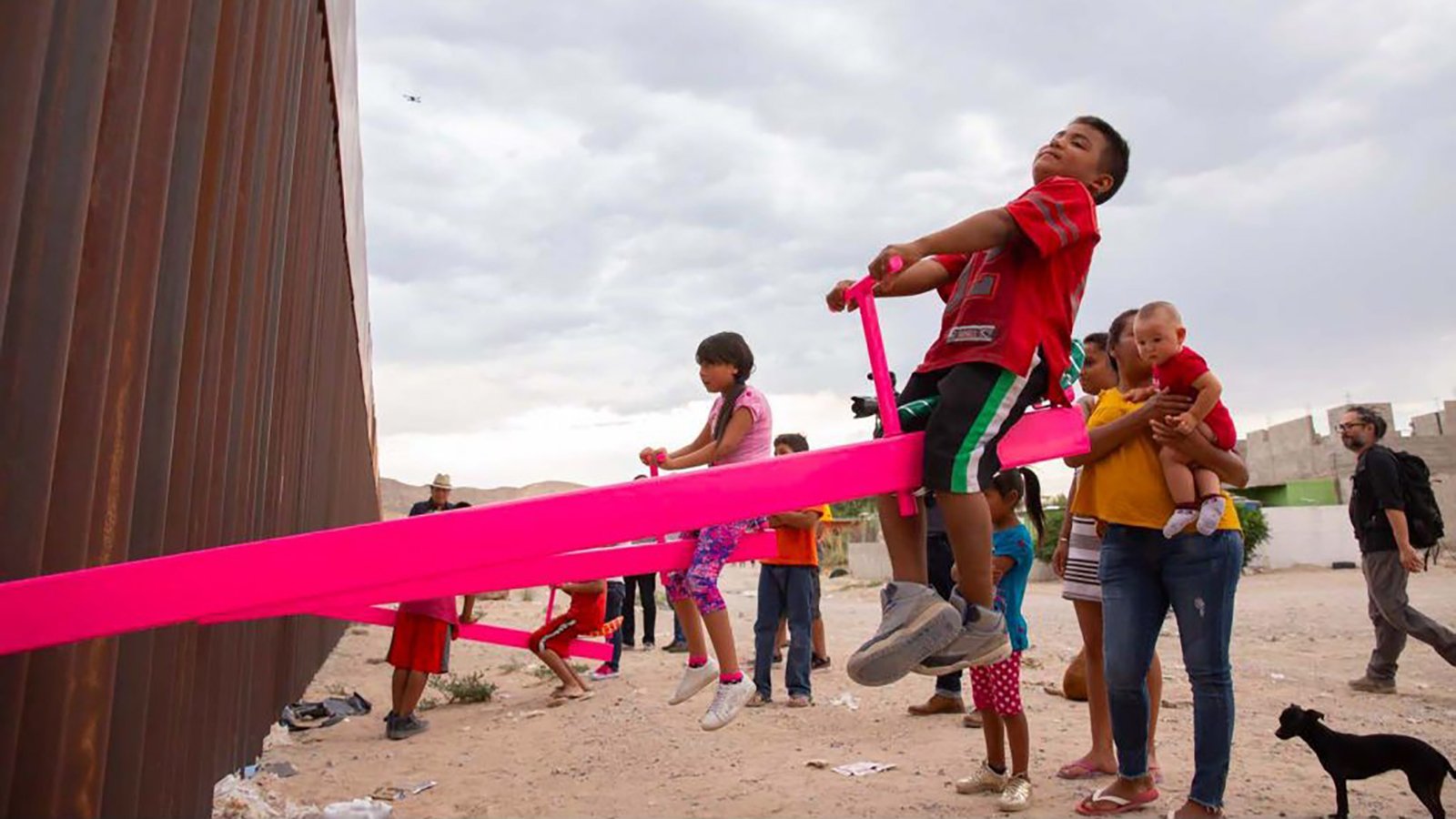 The "Teeter-Totter Wall" allows children to play with each other in New Mexico and Mexico. (Credit: University of California)