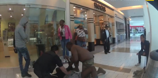 A still from video released July 2, 2019, by the San Bruno Police Department shows a victim being tended to at Tanforan Mall after a shooting.