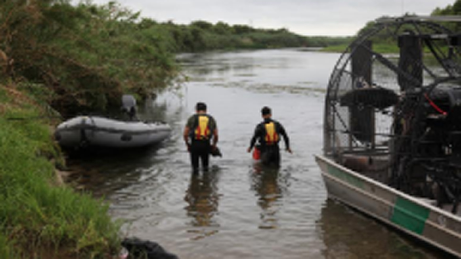 In this photo released by CBP, a Del Rio Sector dive team can be seen searching for a missing 2-year-old girl in the Rio Grande River.