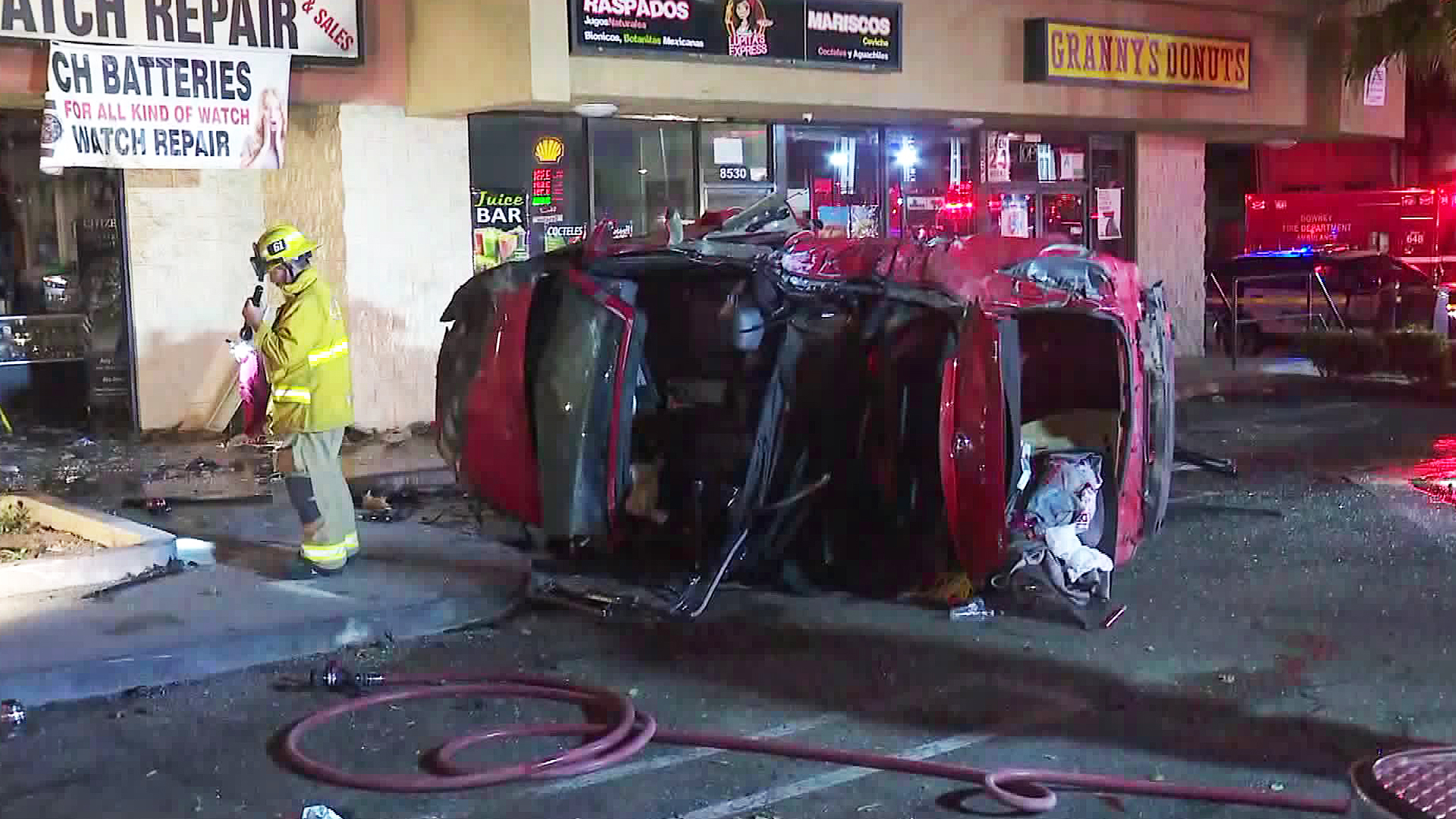 A car went crashing through a watch store in Downey on Aug. 26, 2019. (Credit: KTLA)