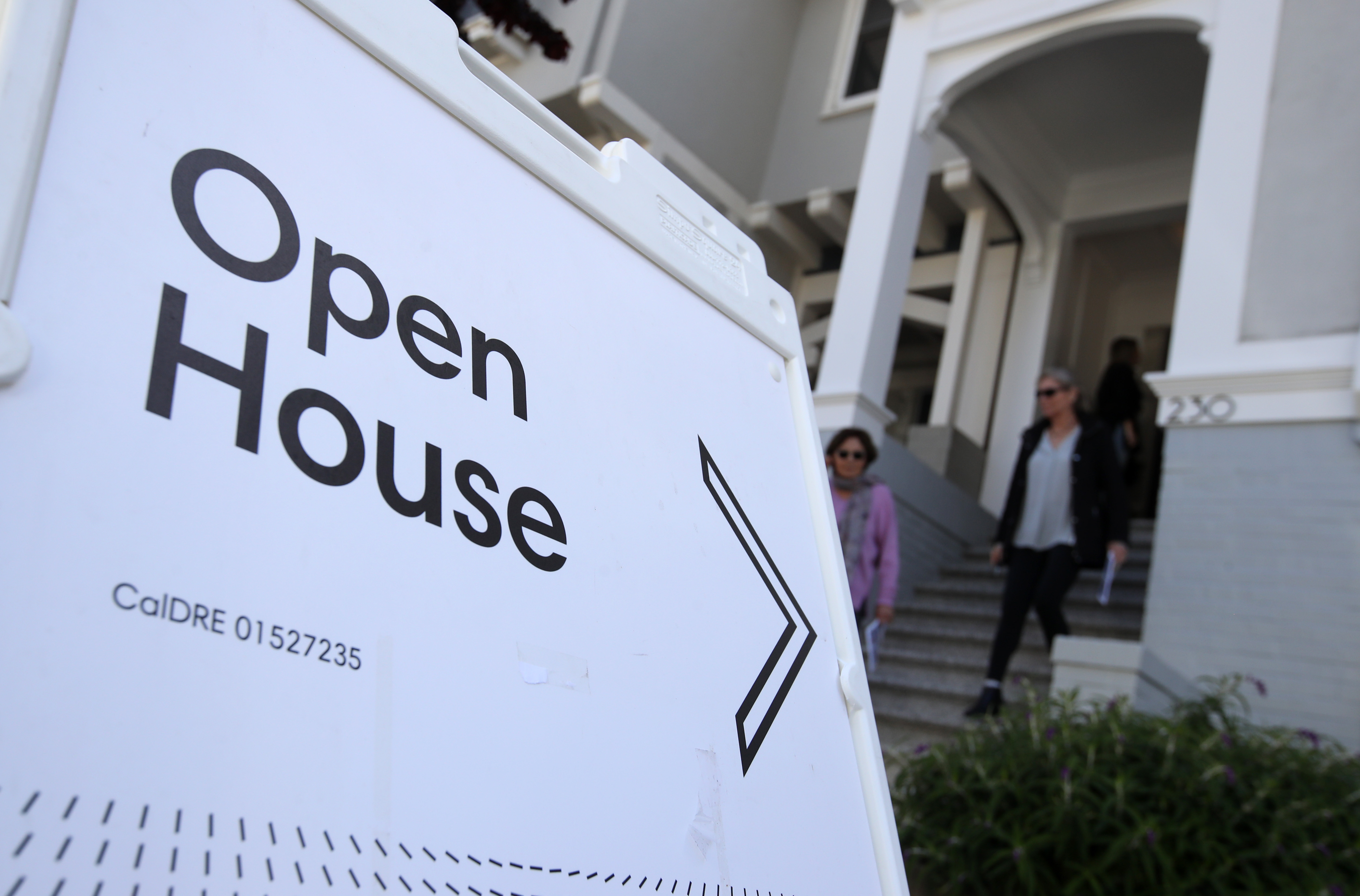 Real estate agents leave a home for sale during a broker open house on April 16, 2019 in San Francisco. (Credit: Justin Sullivan/Getty Images)