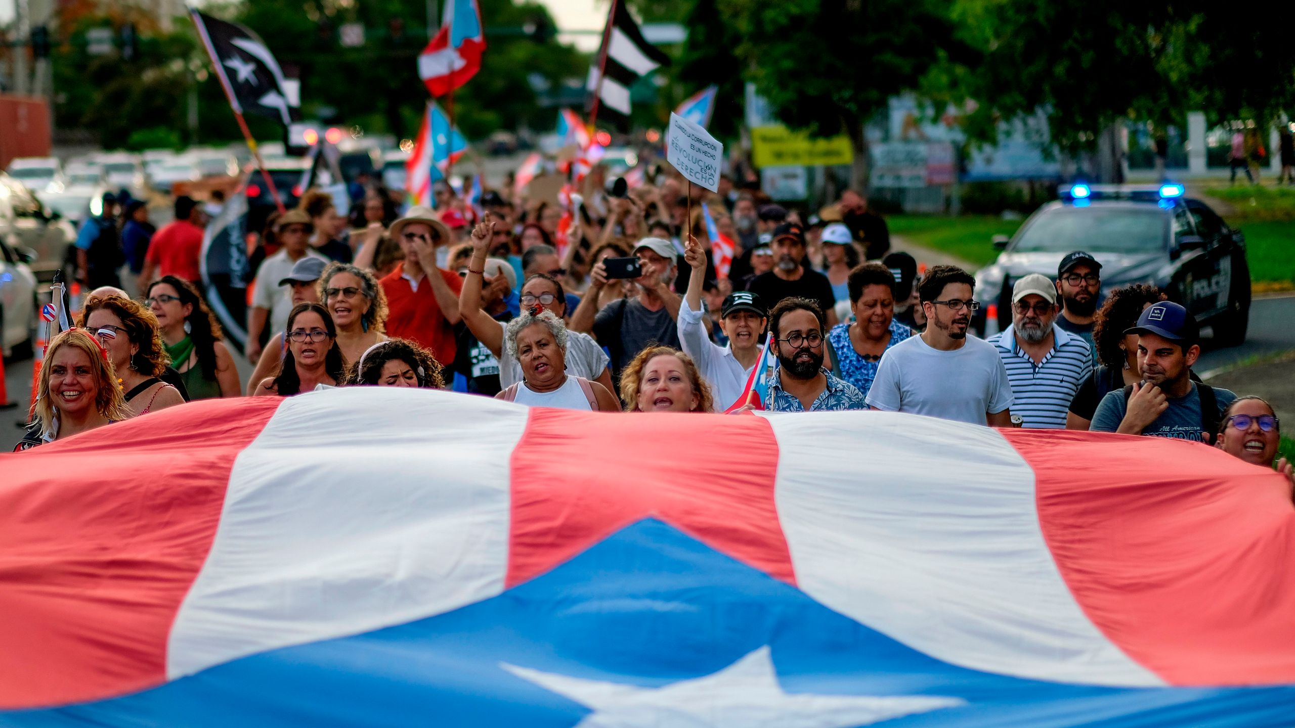 People march in protest in San Juan on July 29, 2019, against Wanda Vazquez, Puerto Rico's current Secretary of Justice, possibly becoming governor. She later rejected the job. (Credit: RICARDO ARDUENGO/AFP/Getty Images)