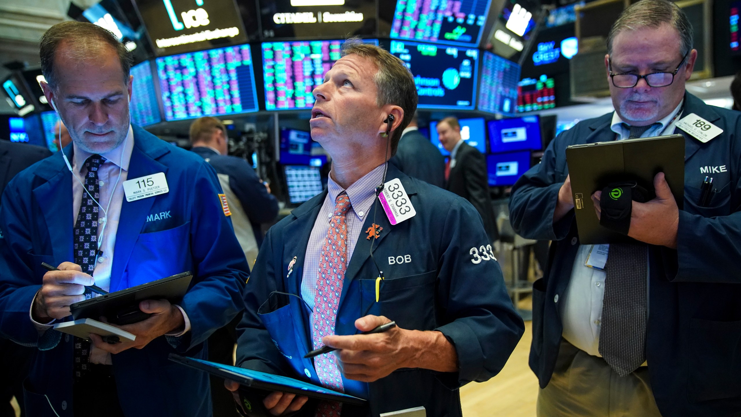 Traders and financial professionals work on the floor of the New York Stock Exchange at the opening bell on Aug. 13, 2019 in New York City. (Credit: Drew Angerer/Getty Images)