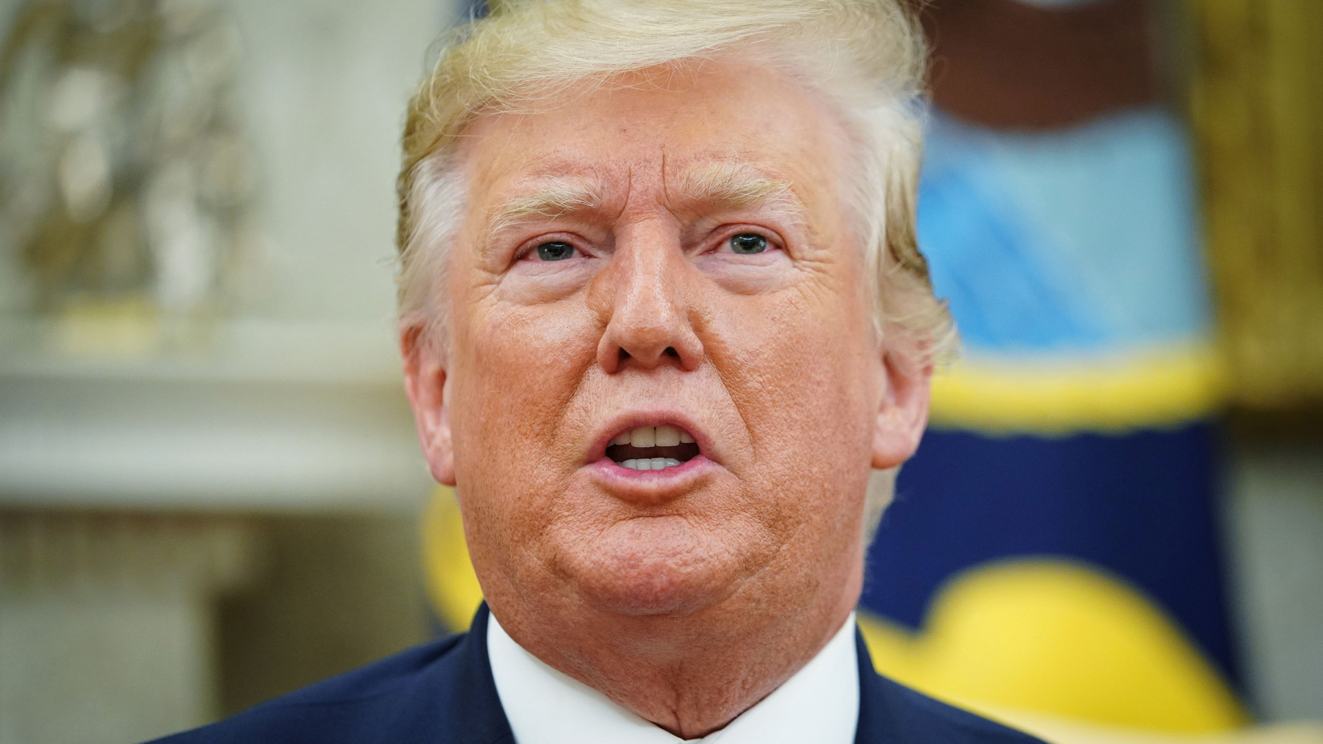 Donald Trump speaks during a meeting with Romania's President Klaus Iohannis in the Oval Office of the White House in Washington, DC on August 20, 2019. (Credit: MANDEL NGAN/AFP/Getty Images)