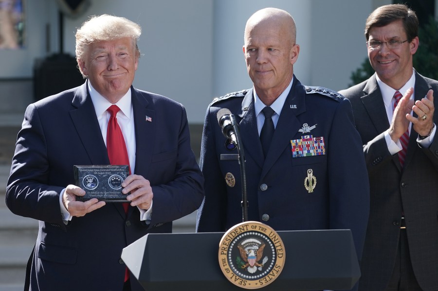 From left: President Donald Trump, Air Force Gen. John "Jay" Raymond and Defense Secretary Mark Esper attend an event marking the establishment the U.S. Space Command, the sixth national armed service, in the Rose Garden at the White House Aug. 29, 2019. (Credit: Chip Somodevilla / Getty Images)