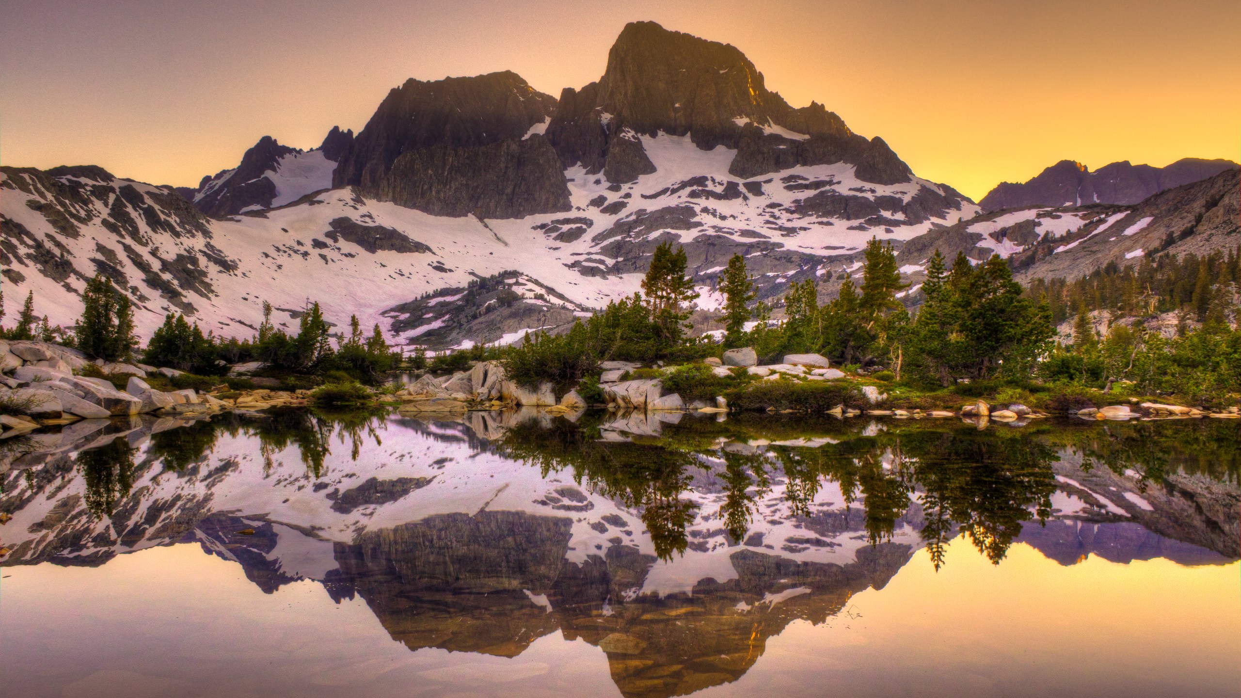 Mount Banner and Mount Ritter are seen reflecting off Garnet Lake, about 2 1/2 miles north of Iceberg Lake, in a stock photo. (Credit: RMB Images / Photography by Robert Bowman via Getty Images)