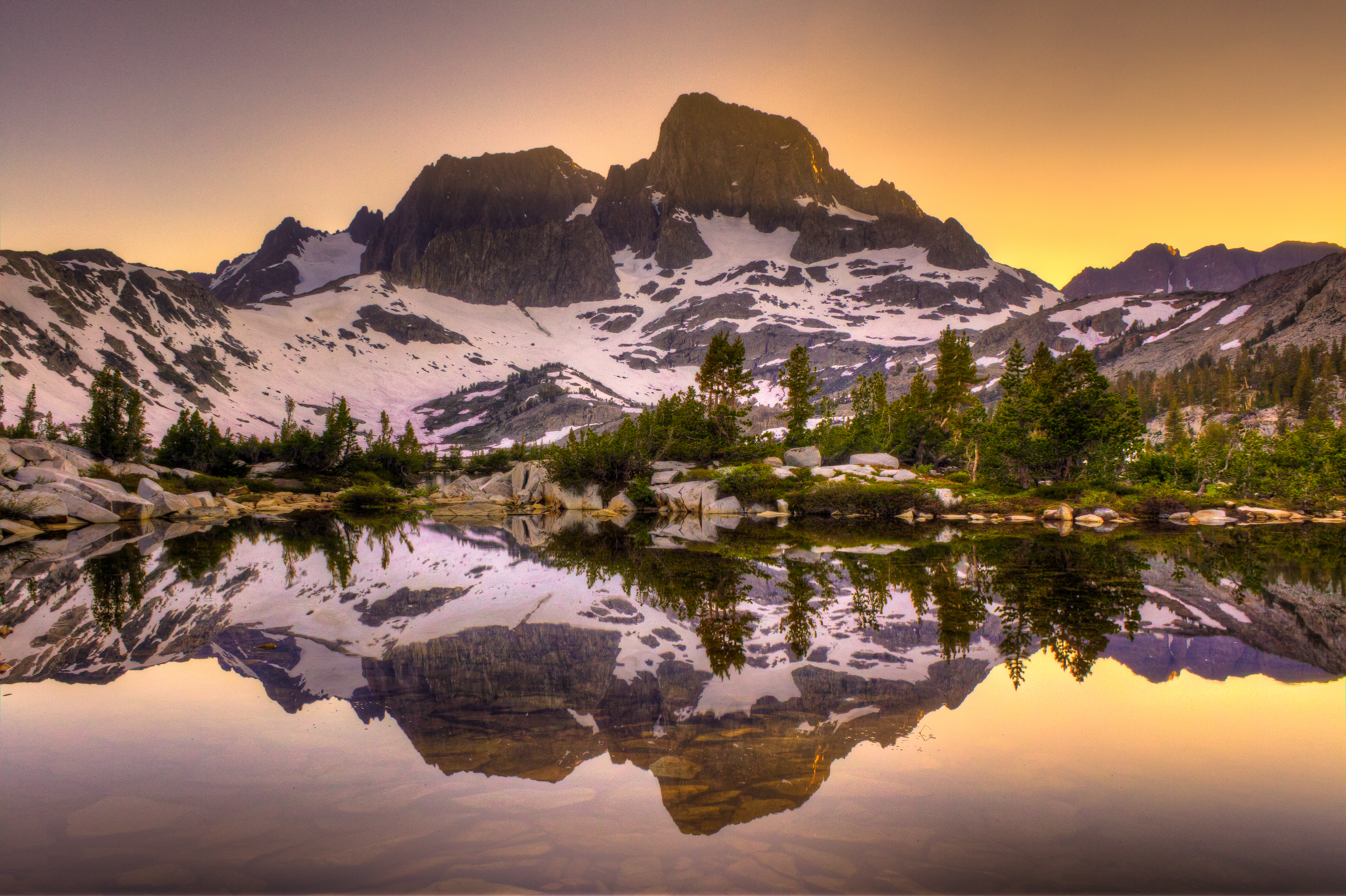 Mount Banner and Mount Ritter are seen reflecting off Garnet Lake, about 2 1/2 miles north of Iceberg Lake, in a stock photo. (Credit: RMB Images / Photography by Robert Bowman via Getty Images)