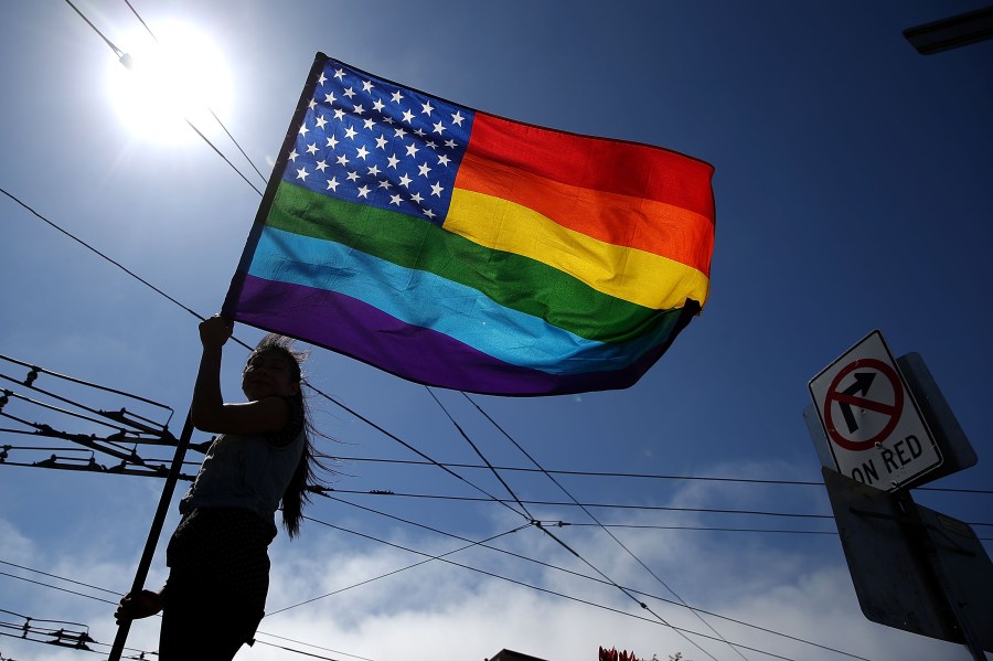 A person waves a pride flag on June 26, 2015 in San Francisco. (Credit: Justin Sullivan/Getty Images)