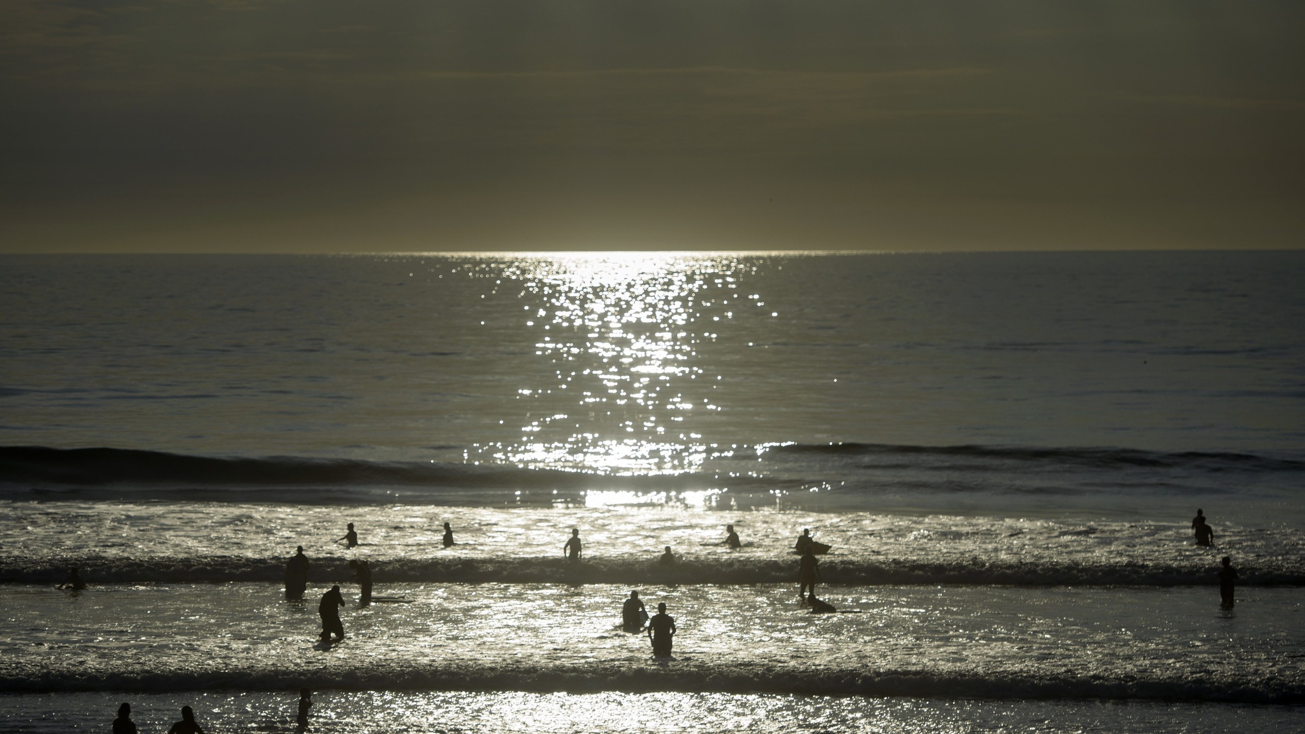 People swim in the Pacific Ocean off Del Mar beach Oct. 11, 2015, in La Jolla, Calif. (Credit: BRENDAN SMIALOWSKI/AFP/Getty Images)