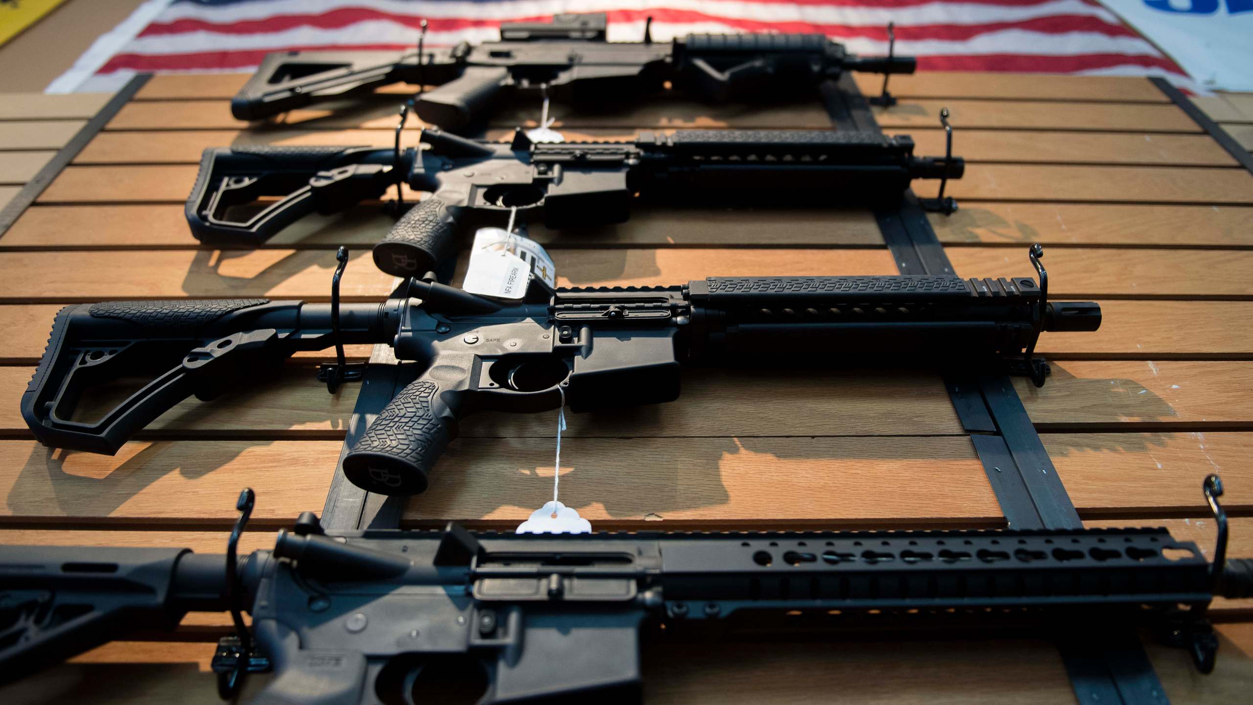 Assault rifles hang on the wall for sale at Blue Ridge Arsenal in Chantilly, Virginia, on Oct. 6, 2017. (Credit: Jim Watson / AFP / Getty Images)