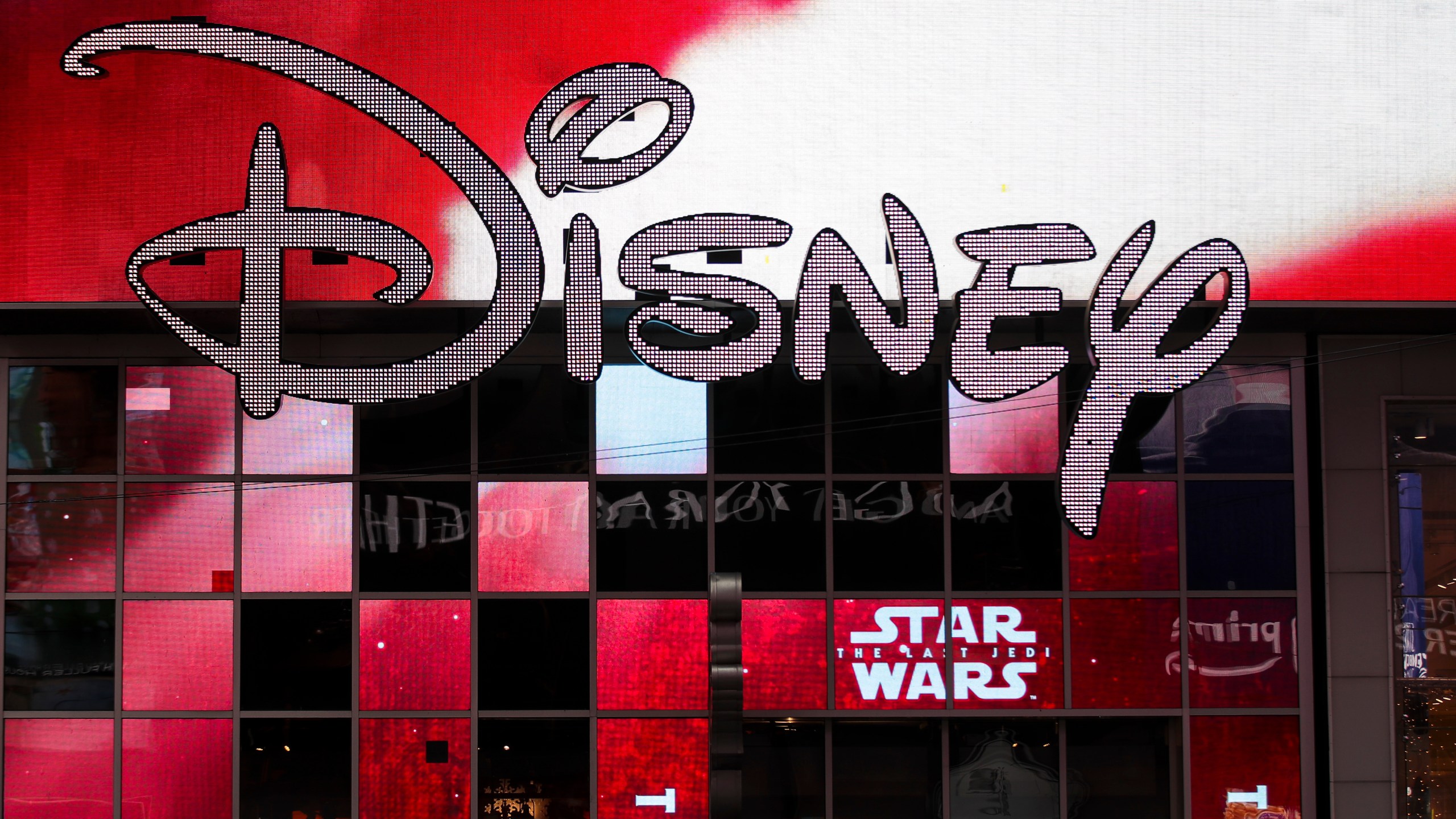 The Disney logo is displayed outside the Disney Store in Times Square on Dec. 14, 2017, in New York City. (Credit: Drew Angerer/Getty Images)