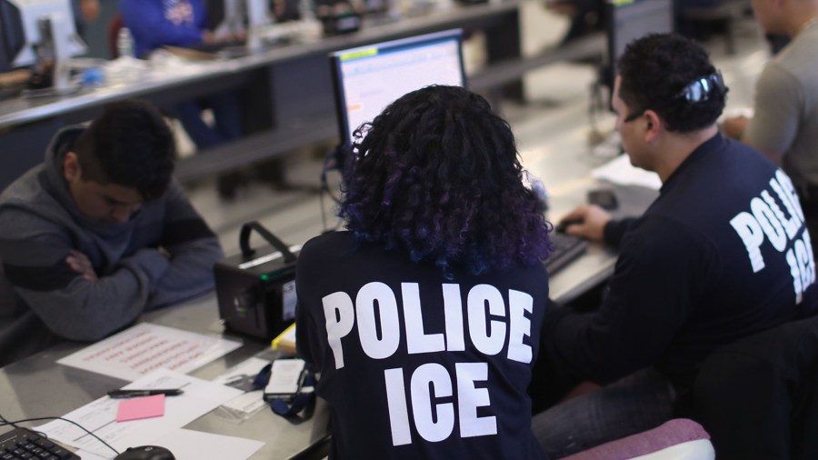 U.S. Immigration and Customs Enforcement officers process detained immigrants on April 11, 2018, at the U.S. Federal Building in New York City. (Credit: John Moore/Getty Images)