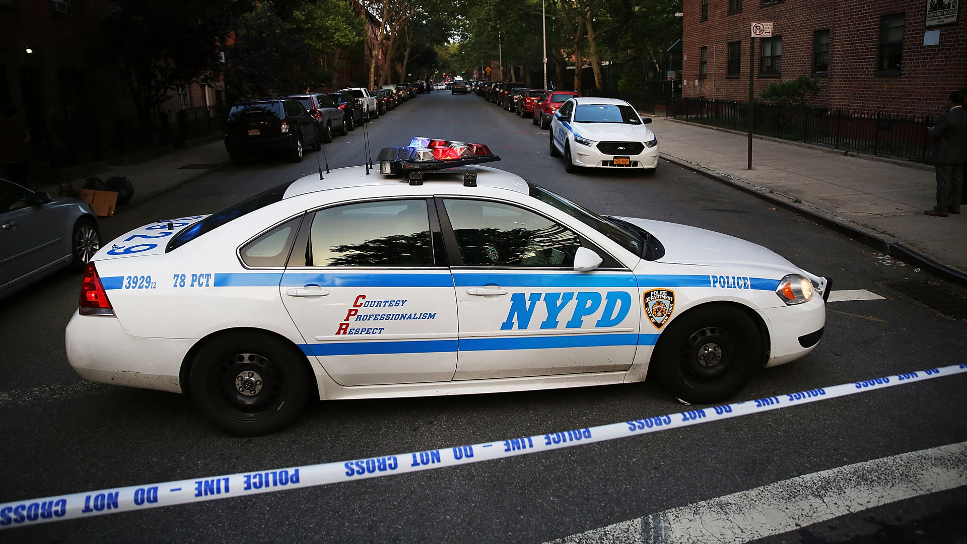 An NYPD police car is parked at a crime scene in Brooklyn on June 10, 2015. (Credit: Spencer Platt/Getty Images)