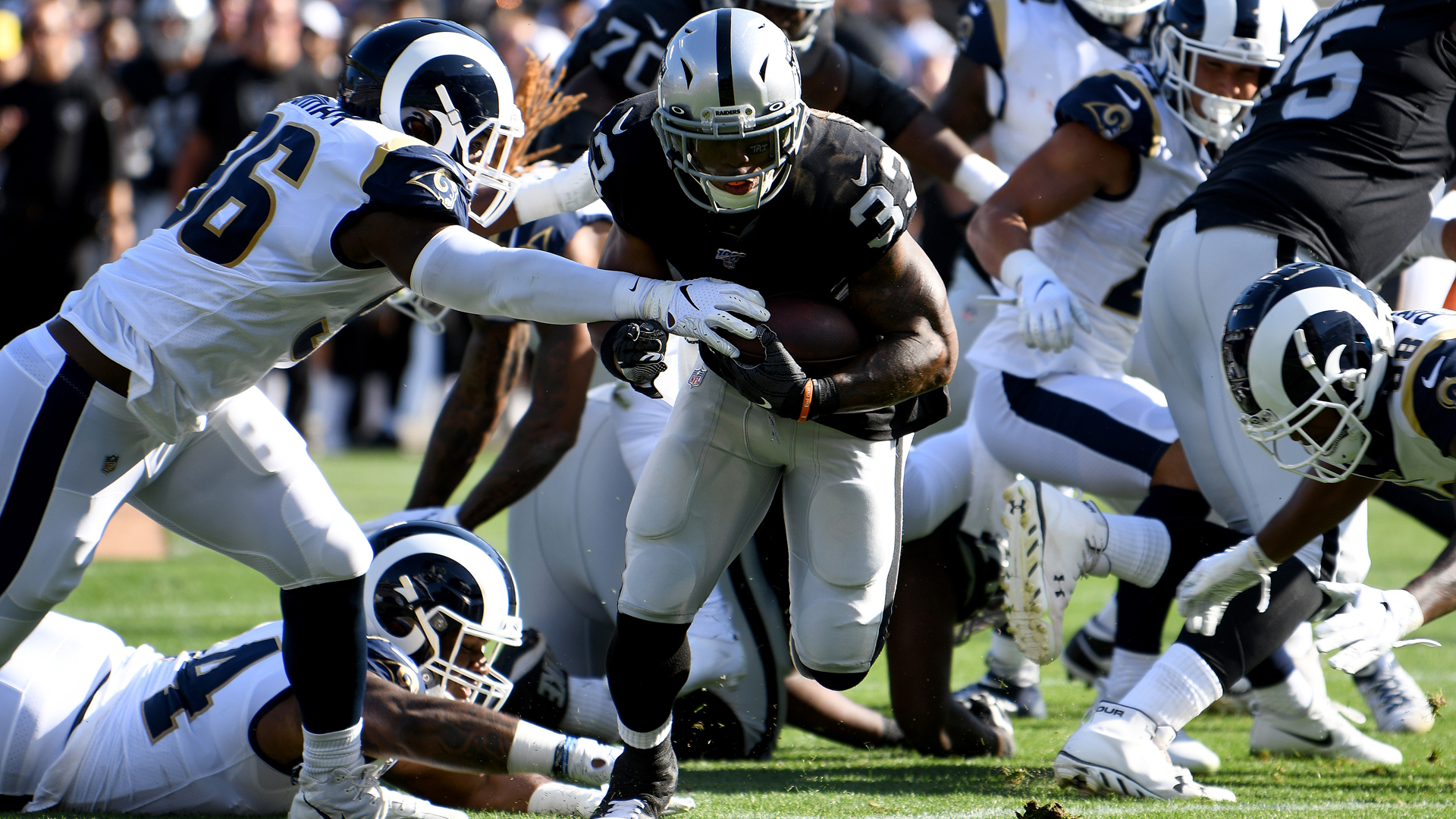 DeAndre Washington #33 of the Oakland Raiders rushes for a touchdown against the Los Angeles Rams during their NFL preseason game at RingCentral Coliseum on August 10, 2019 in Oakland, California. (Credit: Robert Reiners/Getty Images)