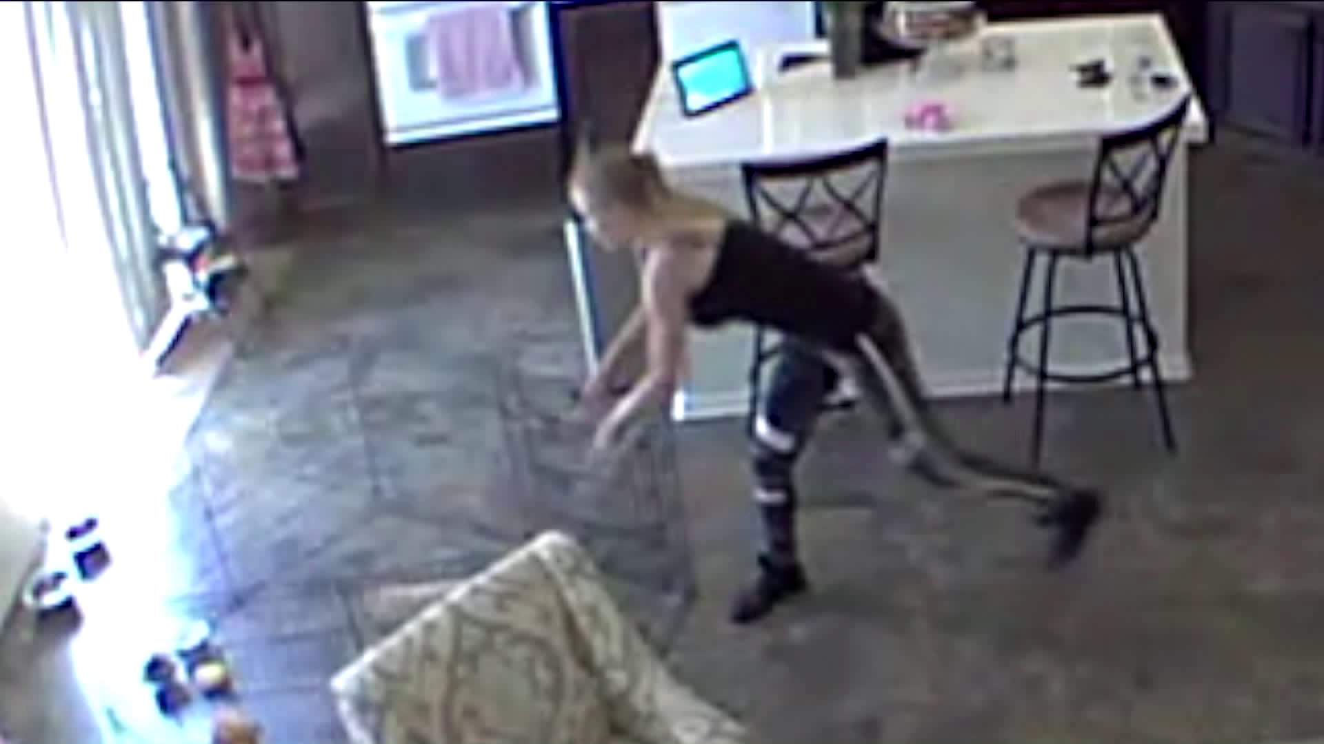 Security footage inside a home shows a Rover worker slamming a puppy to the ground.