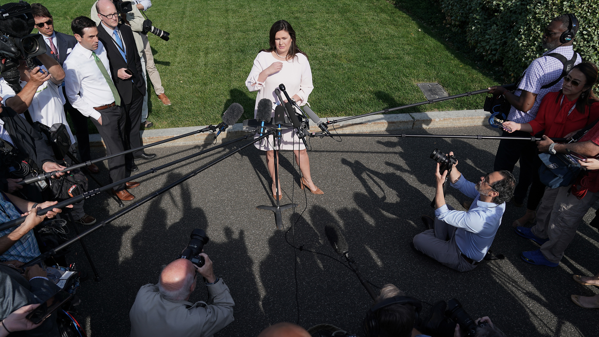 White House Press Secretary Sarah Sanders talks to reporters after an interview with FOX News outside the West Wing on May 23, 2019. (Credit: Chip Somodevilla/Getty Images)