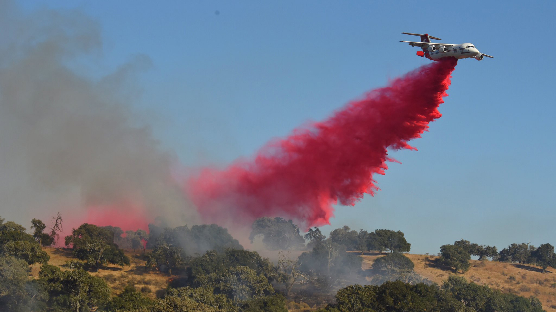 An air tanker drops retardant on the McMurray Fire burning near Buellton on Sept. 9, 2019, in a photo released by Mike Eliason with the Santa Barbara County Fire Department.