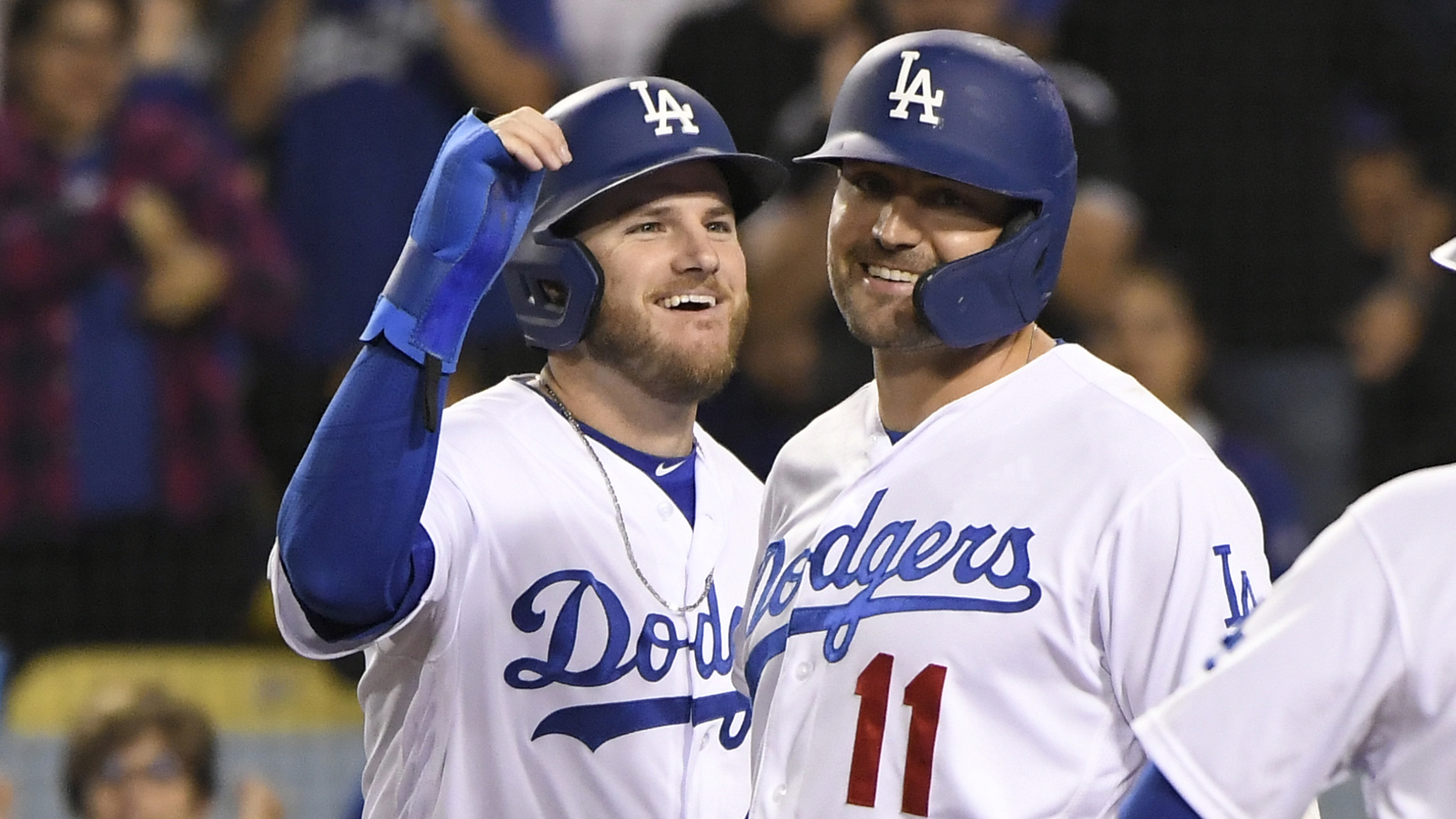 Max Muncy of the Los Angeles Dodgers celebrates with A.J. Pollock during a game against the Colorado Rockies at Dodger Stadium on Sept. 20, 2019. (Credit: John McCoy/Getty Images)