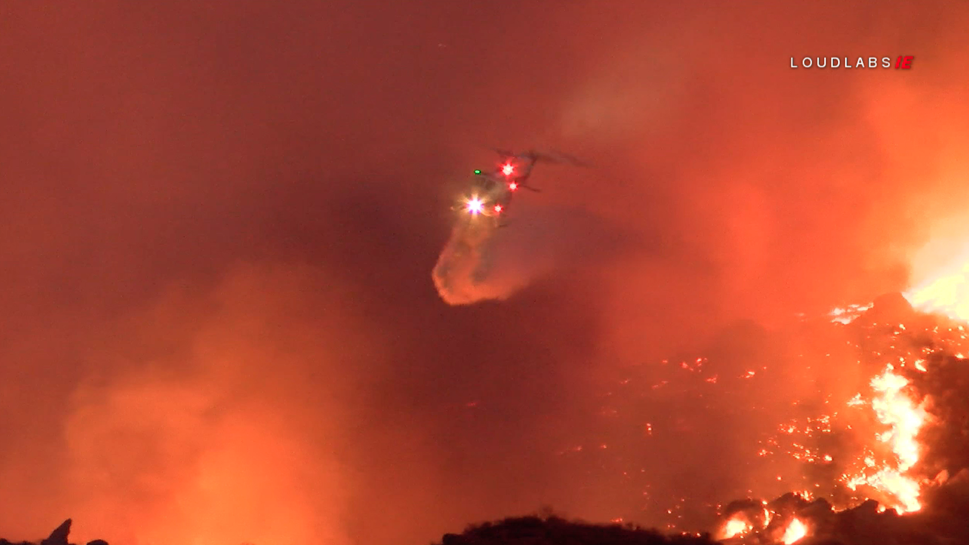 A helicopter drops water on the Horseshoe Fire in Riverside County on Sept. 14, 2019. (Credit: Loudlabs)