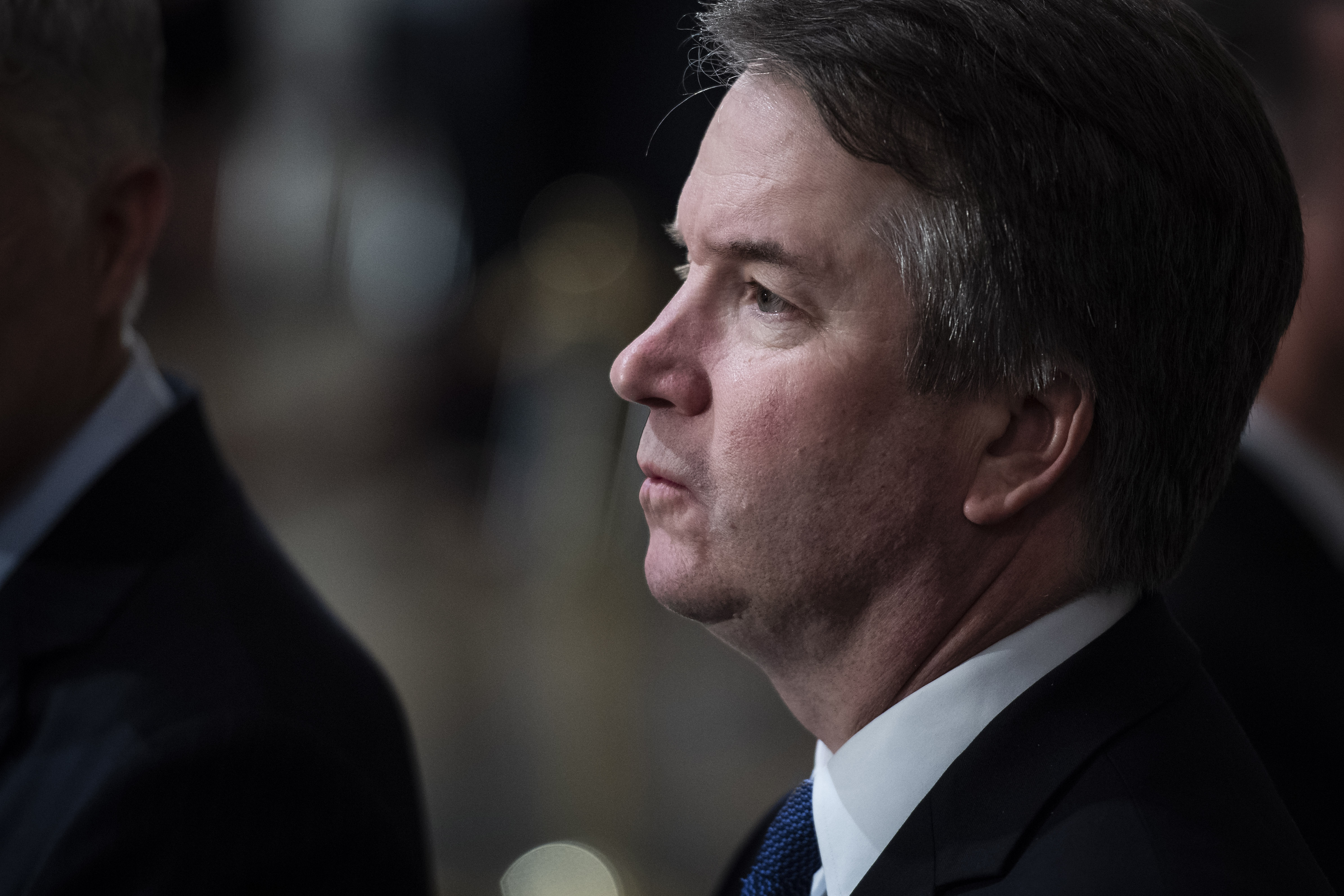 Supreme Court Associate Justice Brett Kavanaugh stands at the U.S Capitol Rotunda as former President George H.W. Bush lies in state on Dec. 3, 2018. (Credit: Jabin Botsford / Getty Images)