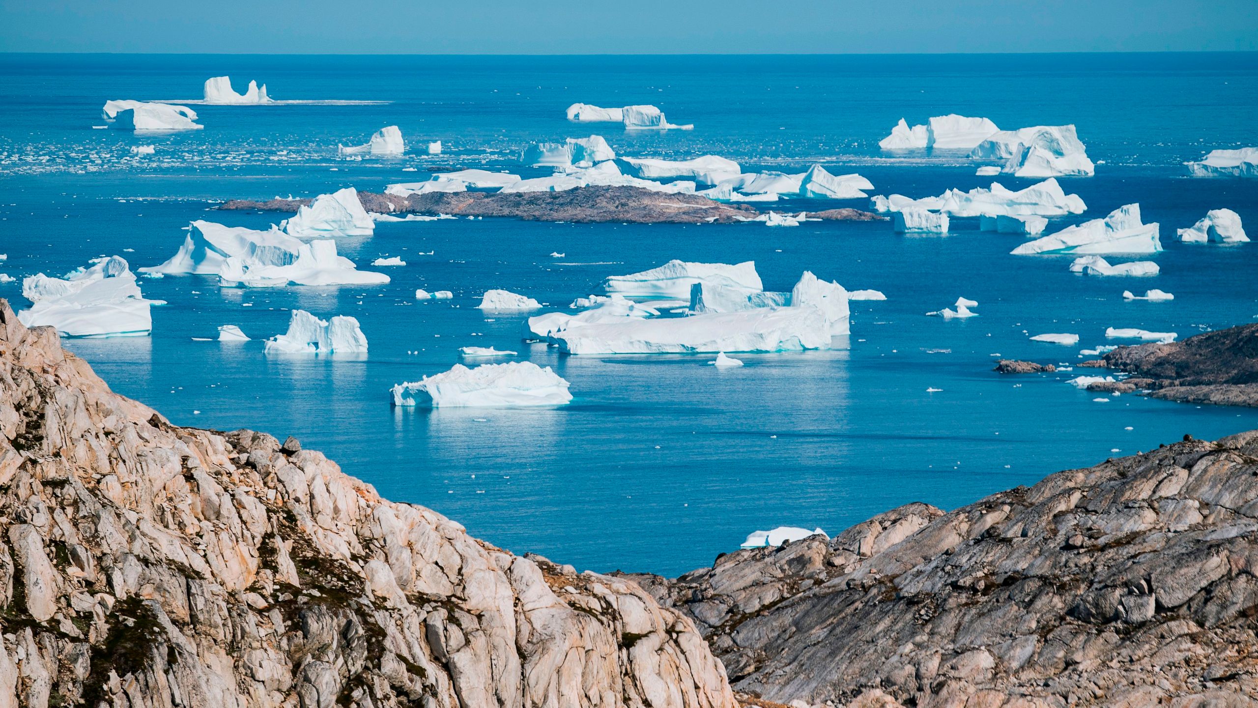 An aerial photo taken on August 15, 2019 shows icebergs as they float along the eastern cost of Greenland near Kulusuk. (Credit: JONATHAN NACKSTRAND/AFP/Getty Images)