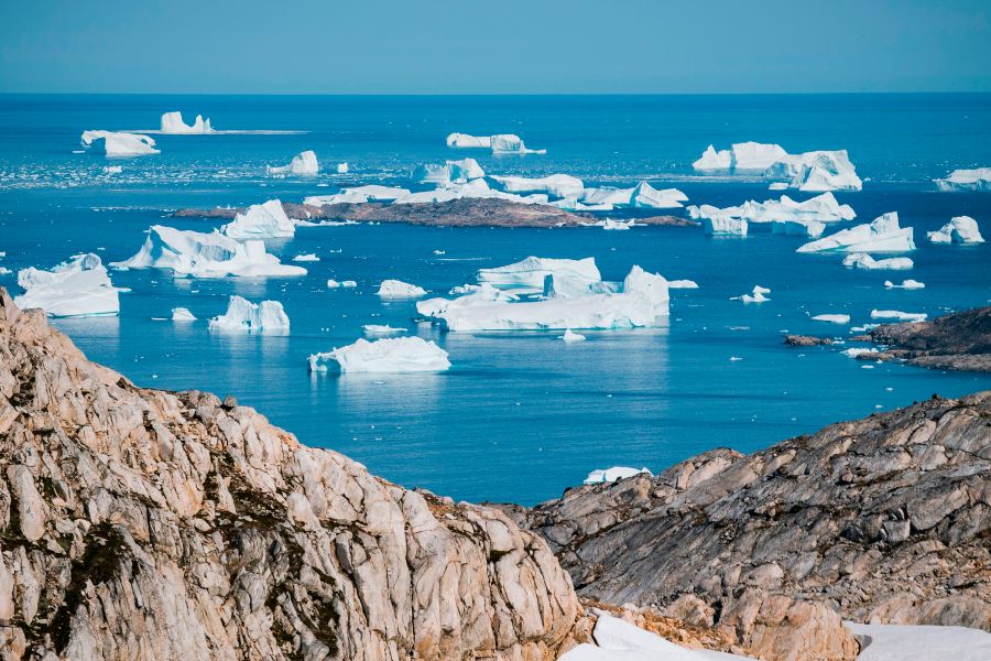 An aerial photo taken on August 15, 2019 shows icebergs as they float along the eastern cost of Greenland near Kulusuk. (Credit: JONATHAN NACKSTRAND/AFP/Getty Images)