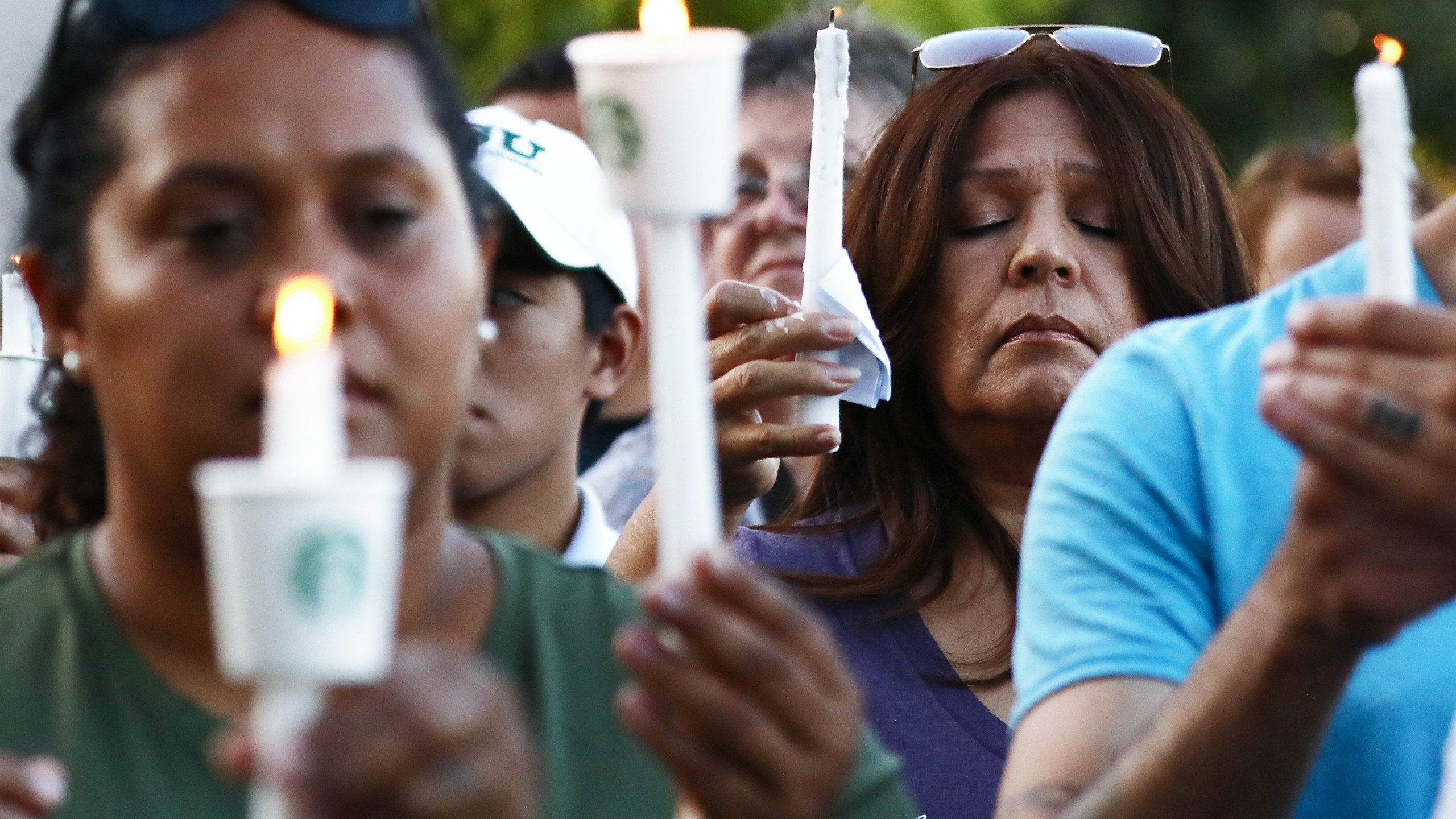 People attend a vigil for victims of a mass shooting at the Gilroy Garlic Festival on July 29, 2019. (Credit: Mario Tama / Getty Images)