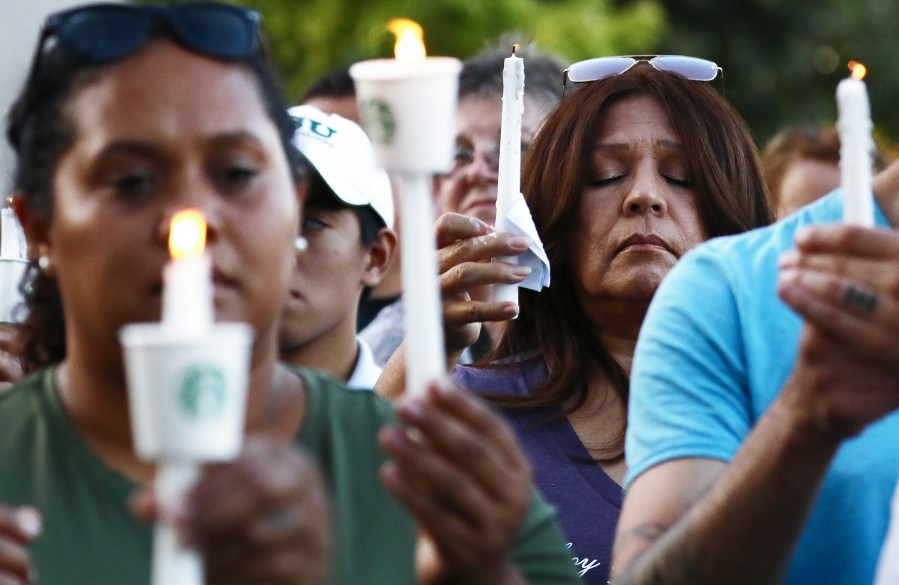 People attend a vigil for victims of a mass shooting at the Gilroy Garlic Festival on July 29, 2019. (Credit: Mario Tama / Getty Images)