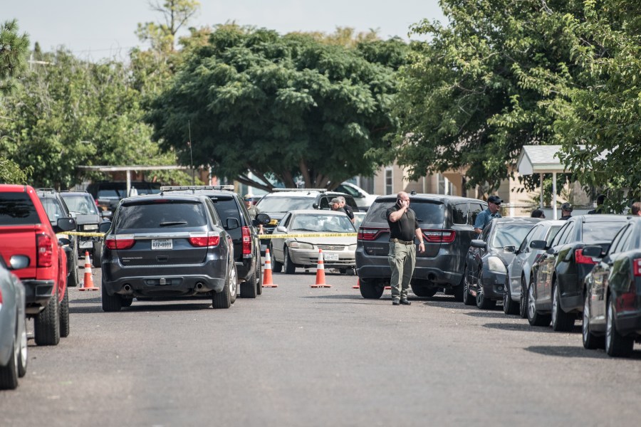 Officers inspect a car on Sept. 1, 2019 in the aftermath of a mass shooting in Odessa, Texas. (Credit: Cengiz Yar/Getty Images)