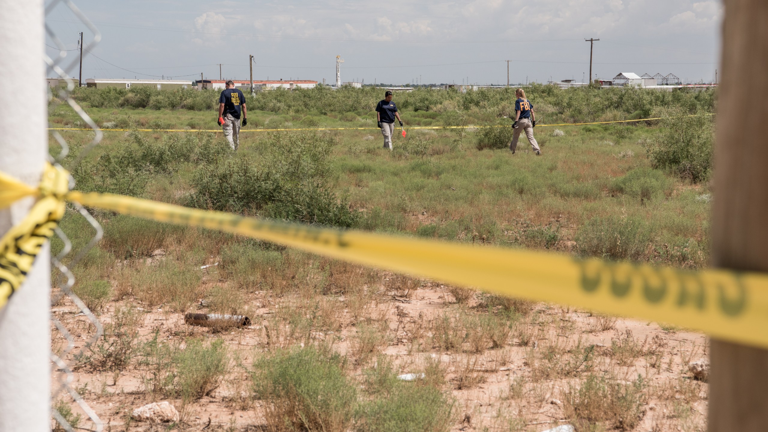 FBI agents search a home believed to be linked to a suspect following a deadly shooting spree on Sept. 1, 2019 in West Odessa, Texas. (Credit: Cengiz Yar/Getty Images)