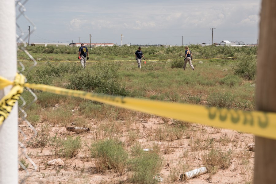 FBI agents search a home believed to be linked to a suspect following a deadly shooting spree on Sept. 1, 2019 in West Odessa, Texas. (Credit: Cengiz Yar/Getty Images)