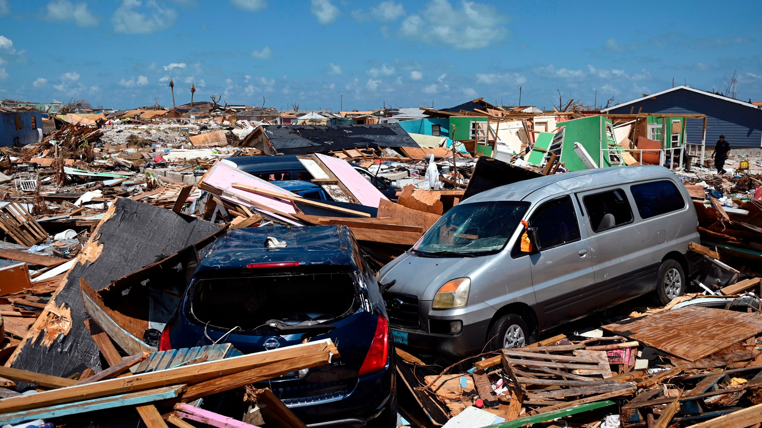 Two cars are seen in an area destroyed by a storm surge in Marsh Harbour, Bahamas on September 10, 2019. (Credit: ANDREW CABALLERO-REYNOLDS/AFP/Getty Images)