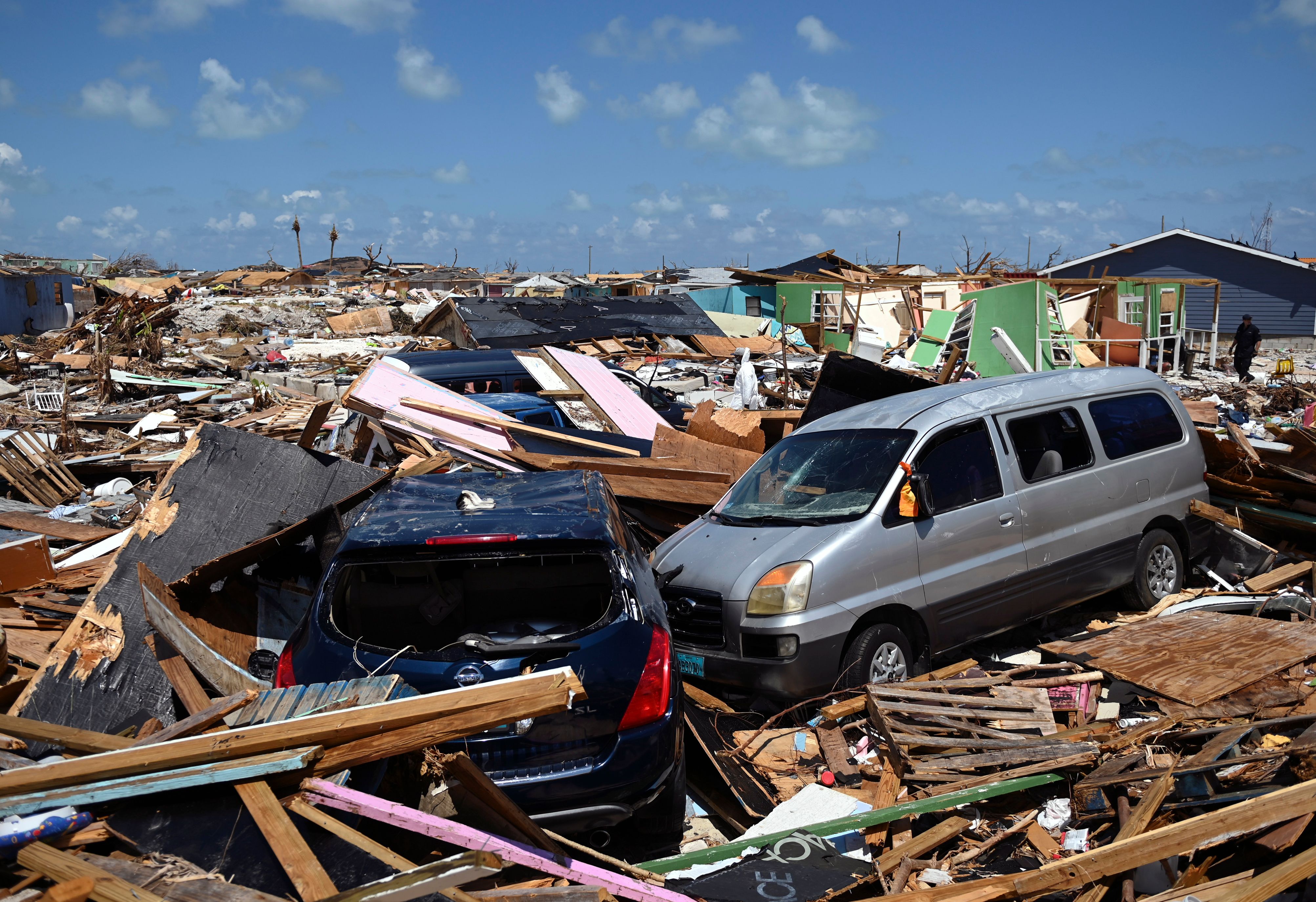 Two cars are seen in an area destroyed by a storm surge in Marsh Harbour, Bahamas on September 10, 2019. (Credit: ANDREW CABALLERO-REYNOLDS/AFP/Getty Images)