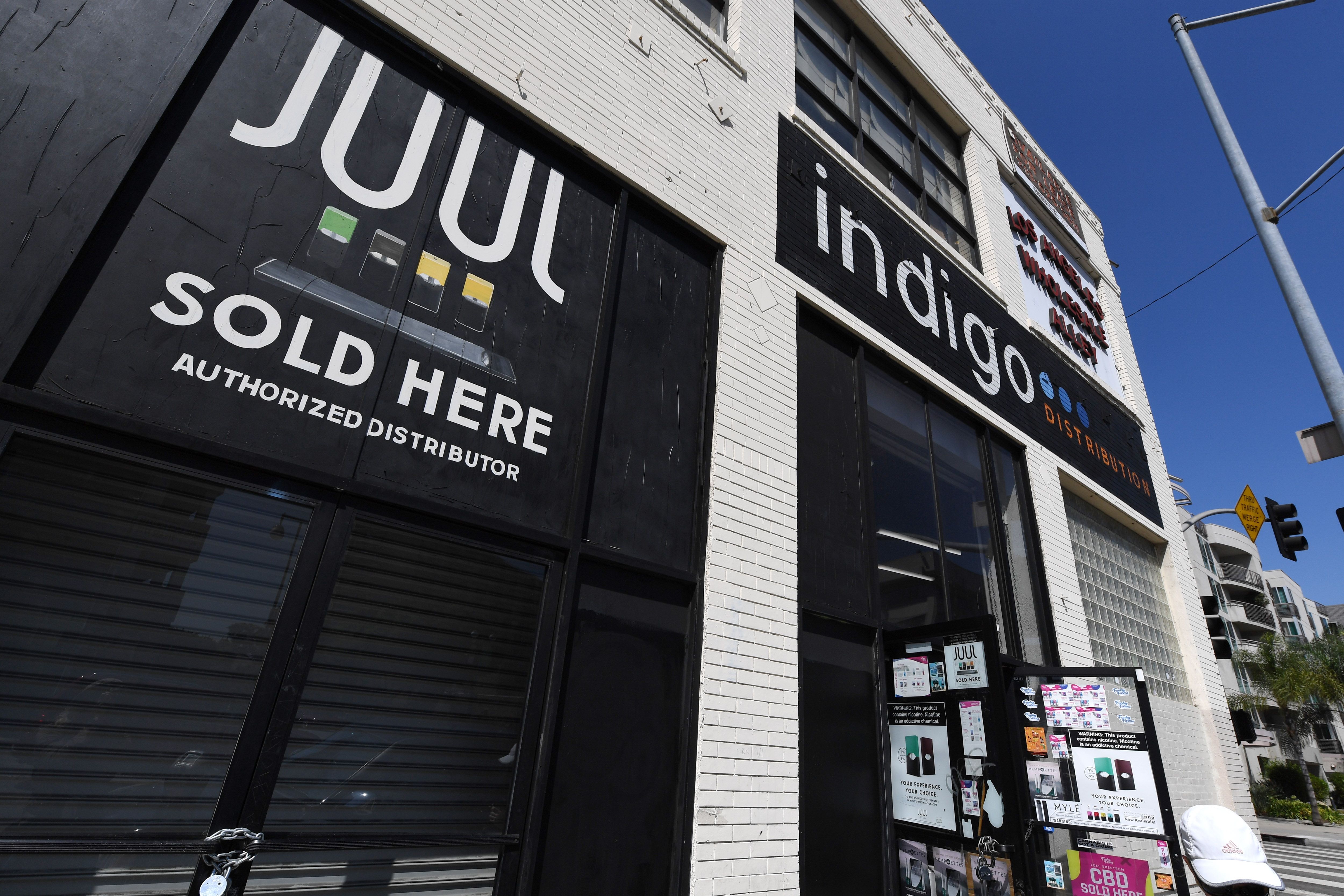 A sign advertises Juul vaping products in Los Angeles on Sept. 17, 2019. (Credit: ROBYN BECK/AFP/Getty Images)