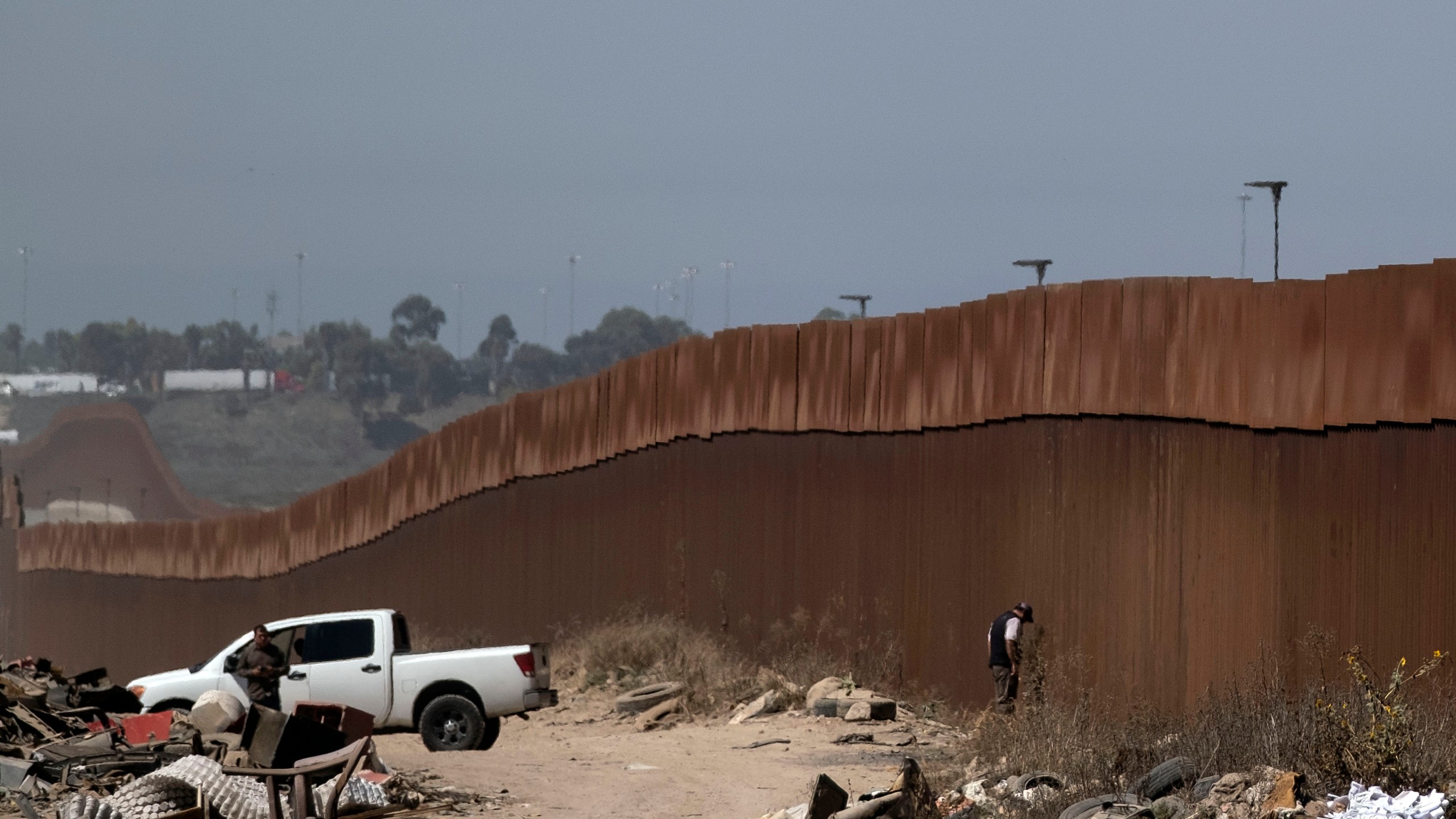 Mexican security forces patrol the U.S.-Mexico border fence in Tijuana Baja California state, Mexico, on Sept. 18, 2019, in preparation for U.S. President Donald Trump's visit to the border wall in Otay Mesa following a rally in San Diego. (Credit: GUILLERMO ARIAS/AFP/Getty Images)