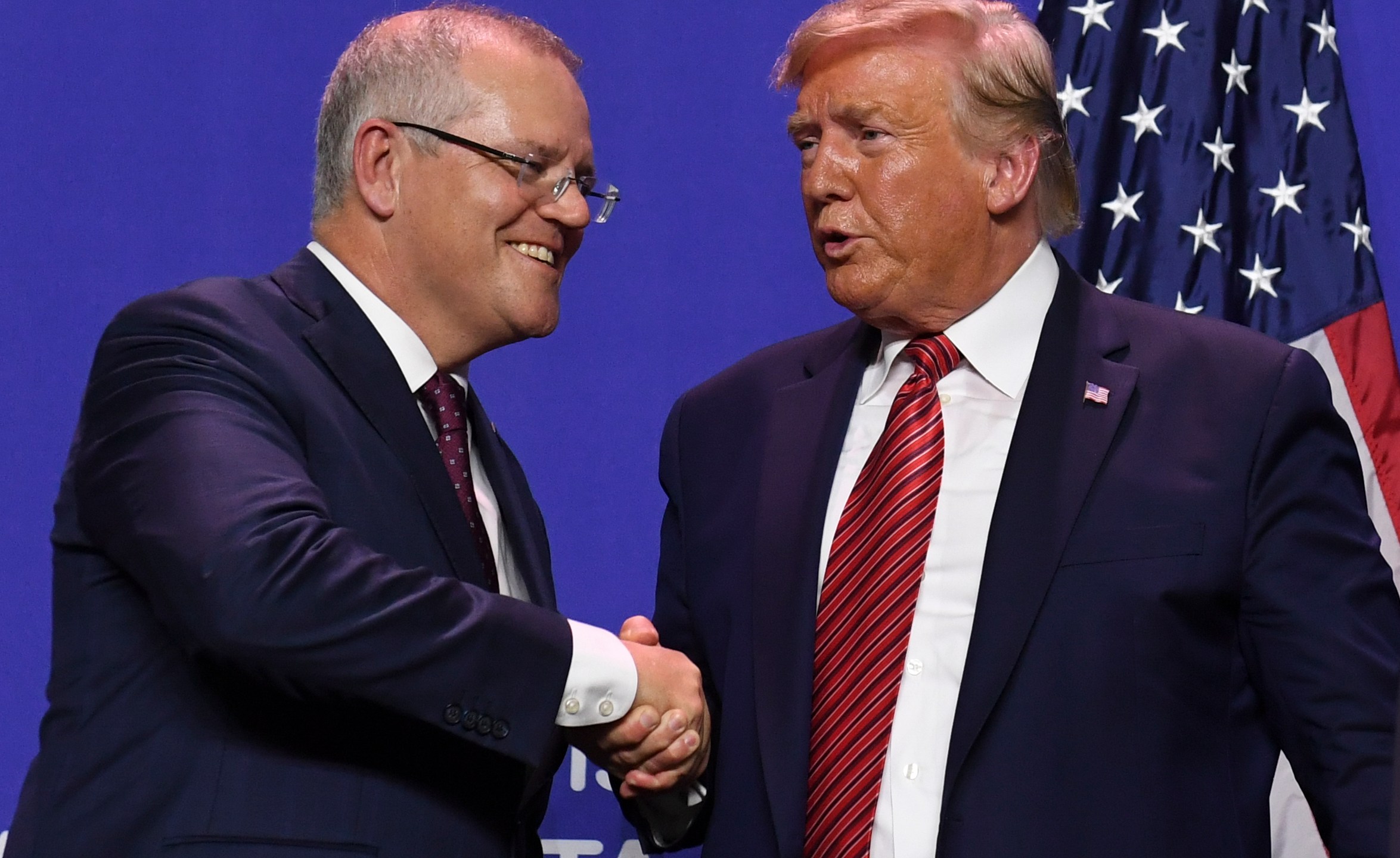 President Donald Trump and Australian Prime Minister Scott Morrison shake hands during a visit to Pratt Industries plant opening in Wapakoneta, Ohio, on Sept. 22, 2019. (Credit: Saul Loeb / AFP / Getty Images)