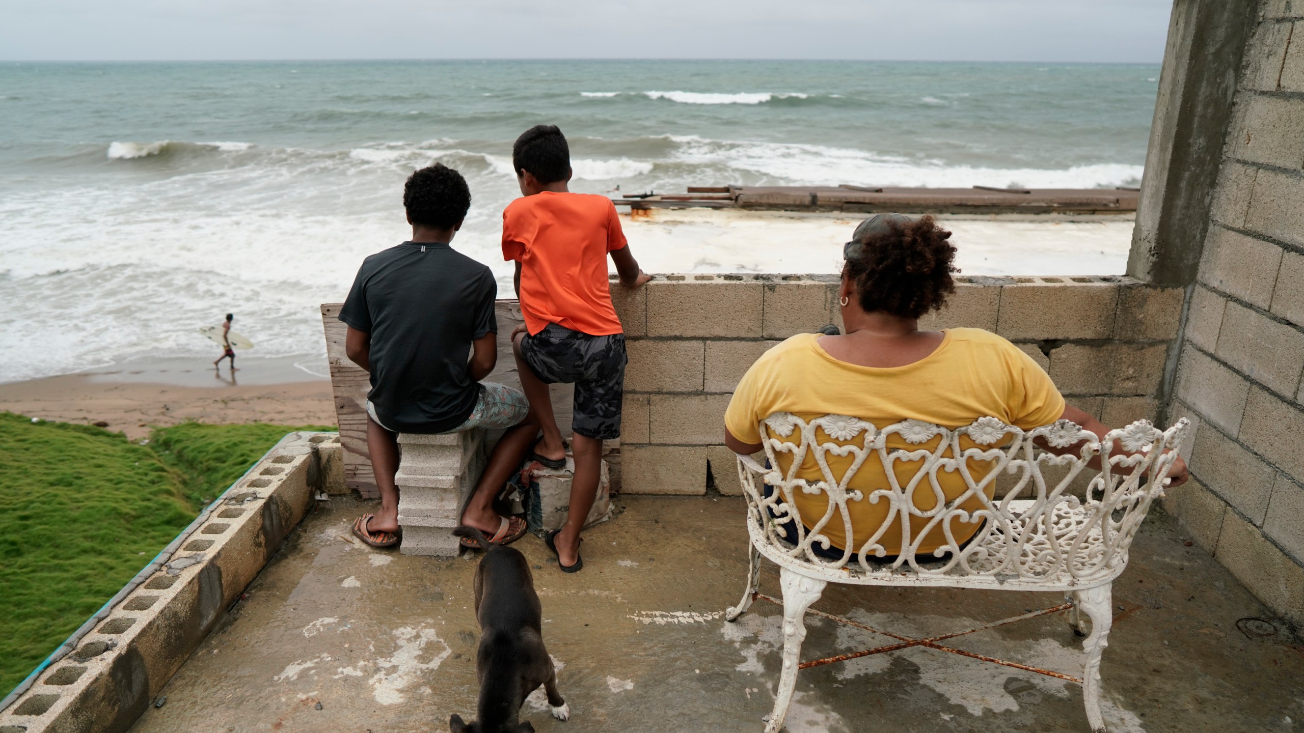 People look out to sea as Tropical Storm Karen approaches in Yabucoa, Puerto Rico, Sept. 24, 2019. (Credit: ERIC ROJAS/AFP/Getty Images)