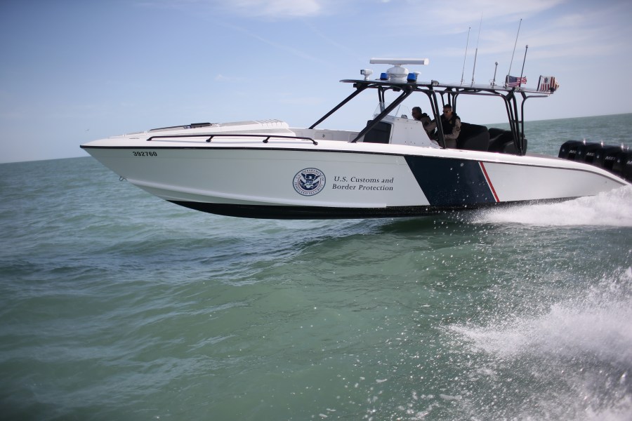 A boat crew from the U.S. Office of Air and Marine (OAM) races through the Gulf of Mexico on April 12, 2013 near Port Isabel, Texas. (Credit: John Moore/Getty Images)