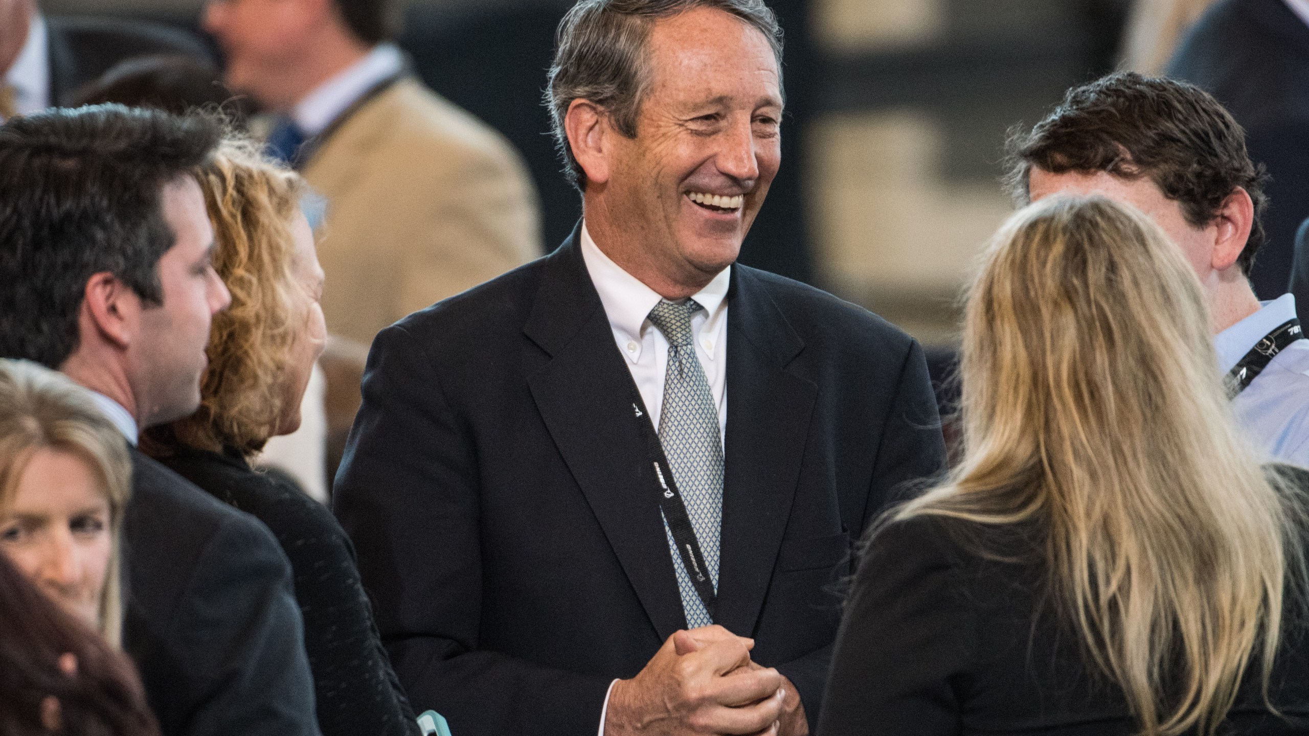 Mark Sanford talks with people before the debut event for the Dreamliner 787-10 where Donald Trump planned to visit, at Boeing's South Carolina facilities on Feb. 17, 2017. (Credit: Sean Rayford/Getty Images)