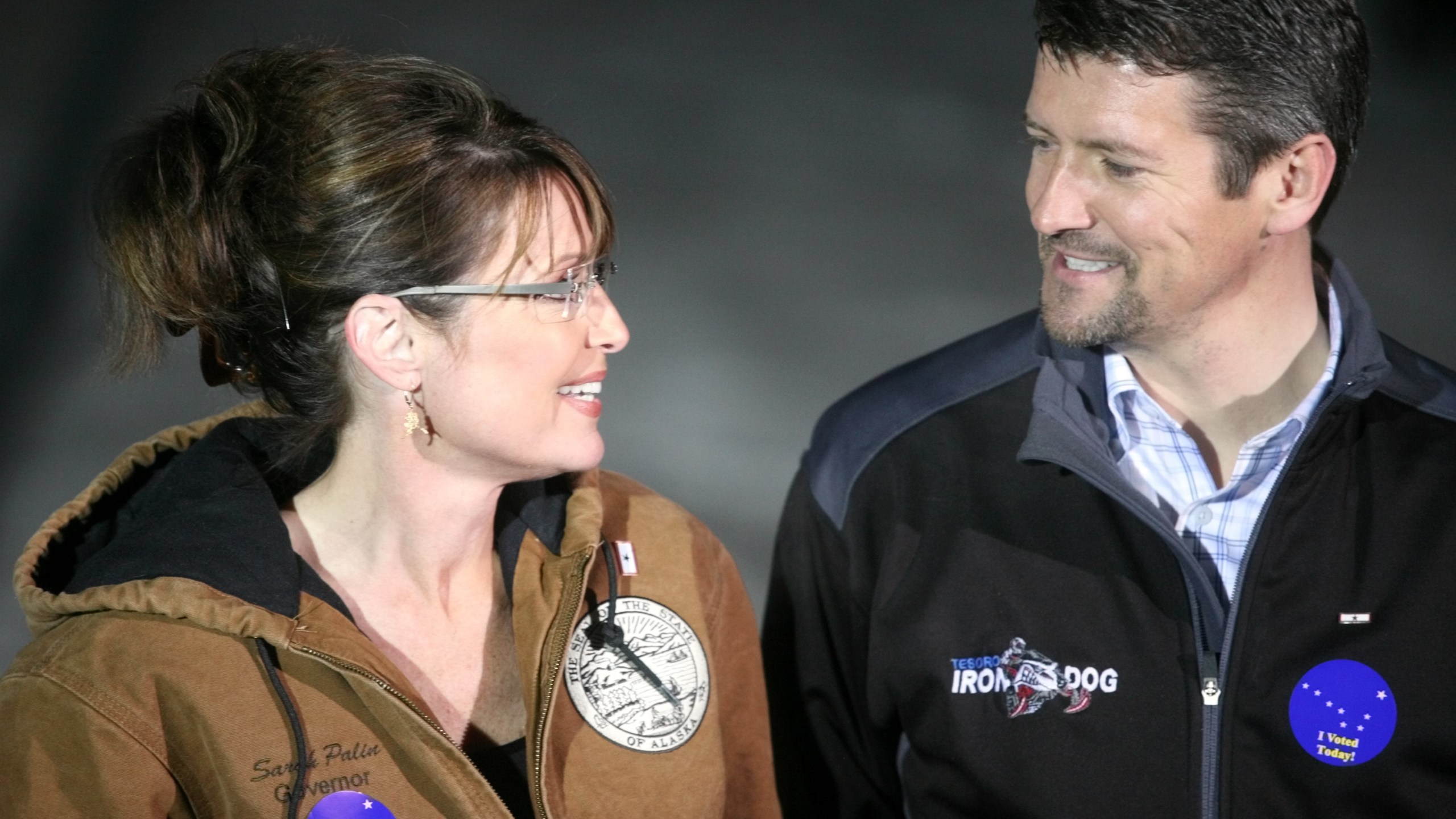 Republican vice-presidential nominee Alaska Gov. Sarah Palin and her husband Todd Palin exchange a glance while speaking with members of the media after casting their votes November 4, 2008 in Wasilla, Alaska. (Credit: Johnny Wagner/Getty Images)