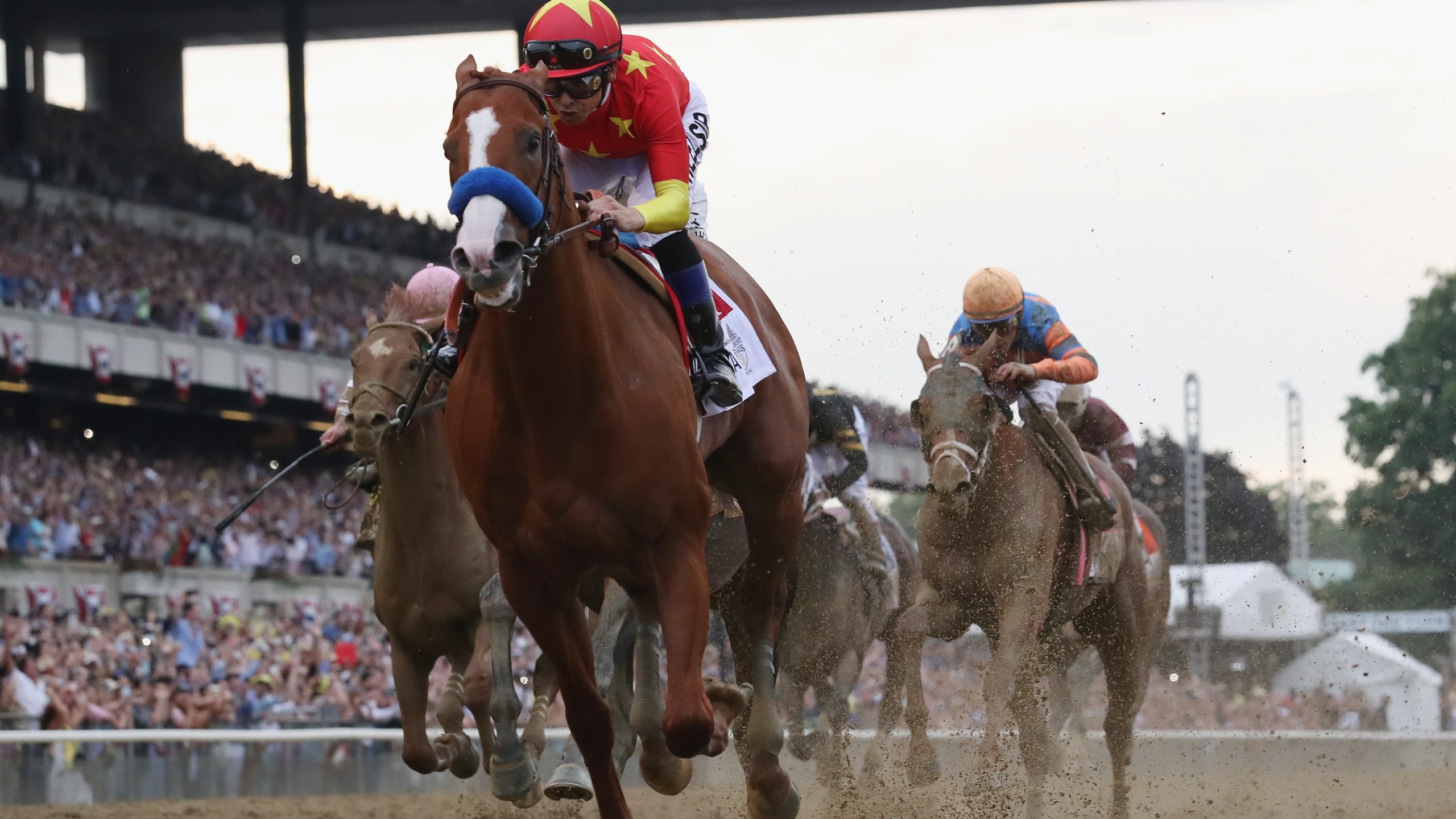 Justify #1, ridden by jockey Mike Smith crosses the finish line to win the 150th running of the Belmont Stakes at Belmont Park on June 9, 2018 in Elmont, New York. (Credit: Rob Carr/Getty Images)