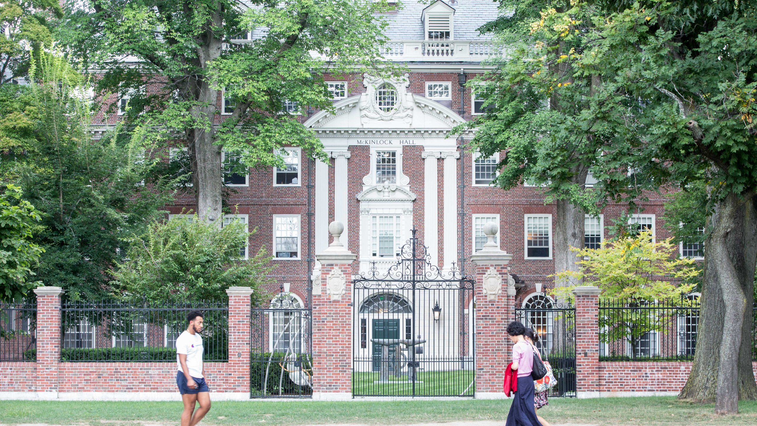 Pedestrians walk past a Harvard University building on Aug. 30, 2018, in Cambridge, Massachusetts. (Credit: Scott Eisen / Getty Images)