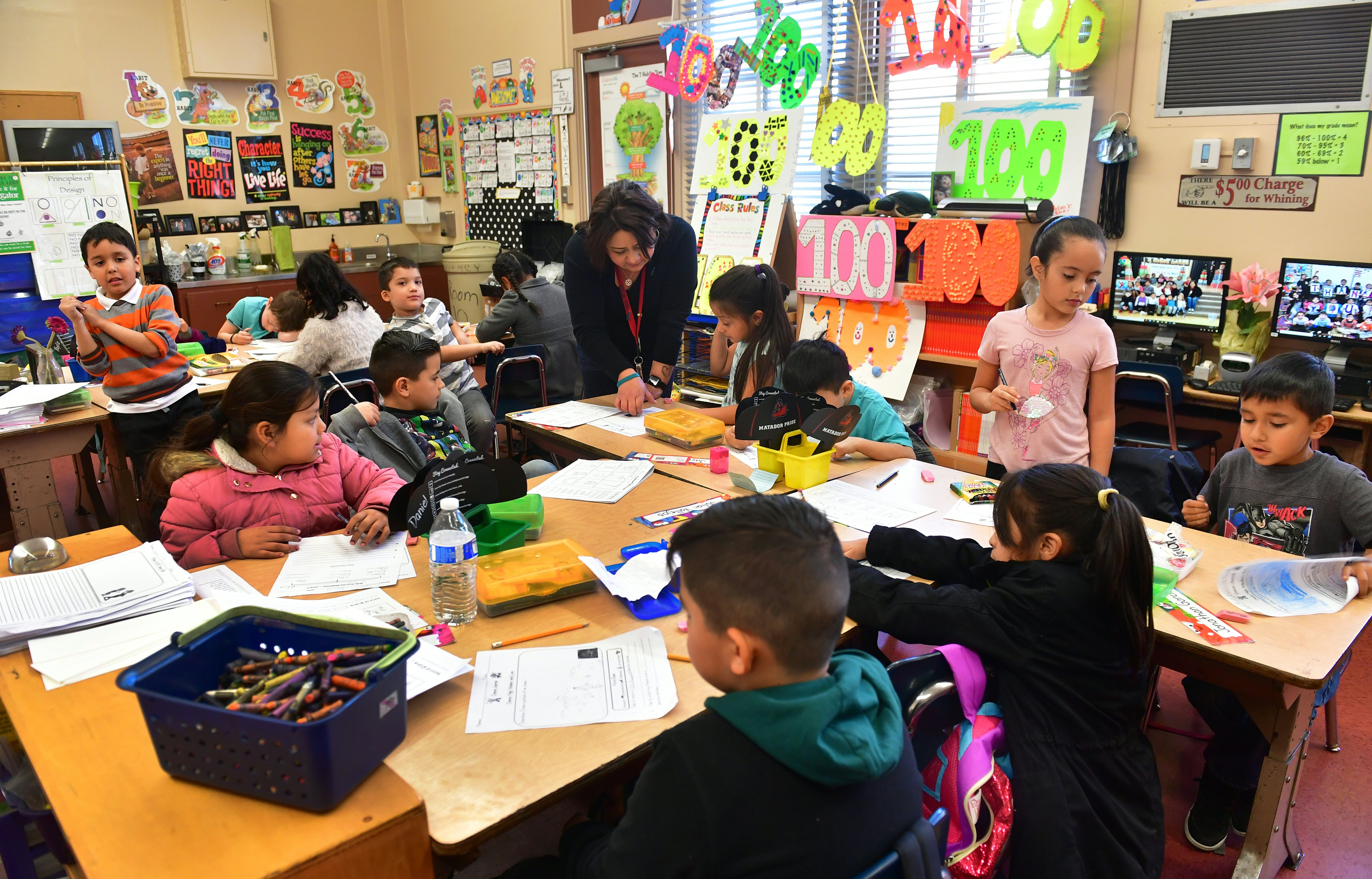 Telfair Elementary School first grade teacher Ms. Gutierrez works with her students on Feb. 8, 2019, in Pacoima. (Credit: FREDERIC J. BROWN/AFP/Getty Images)