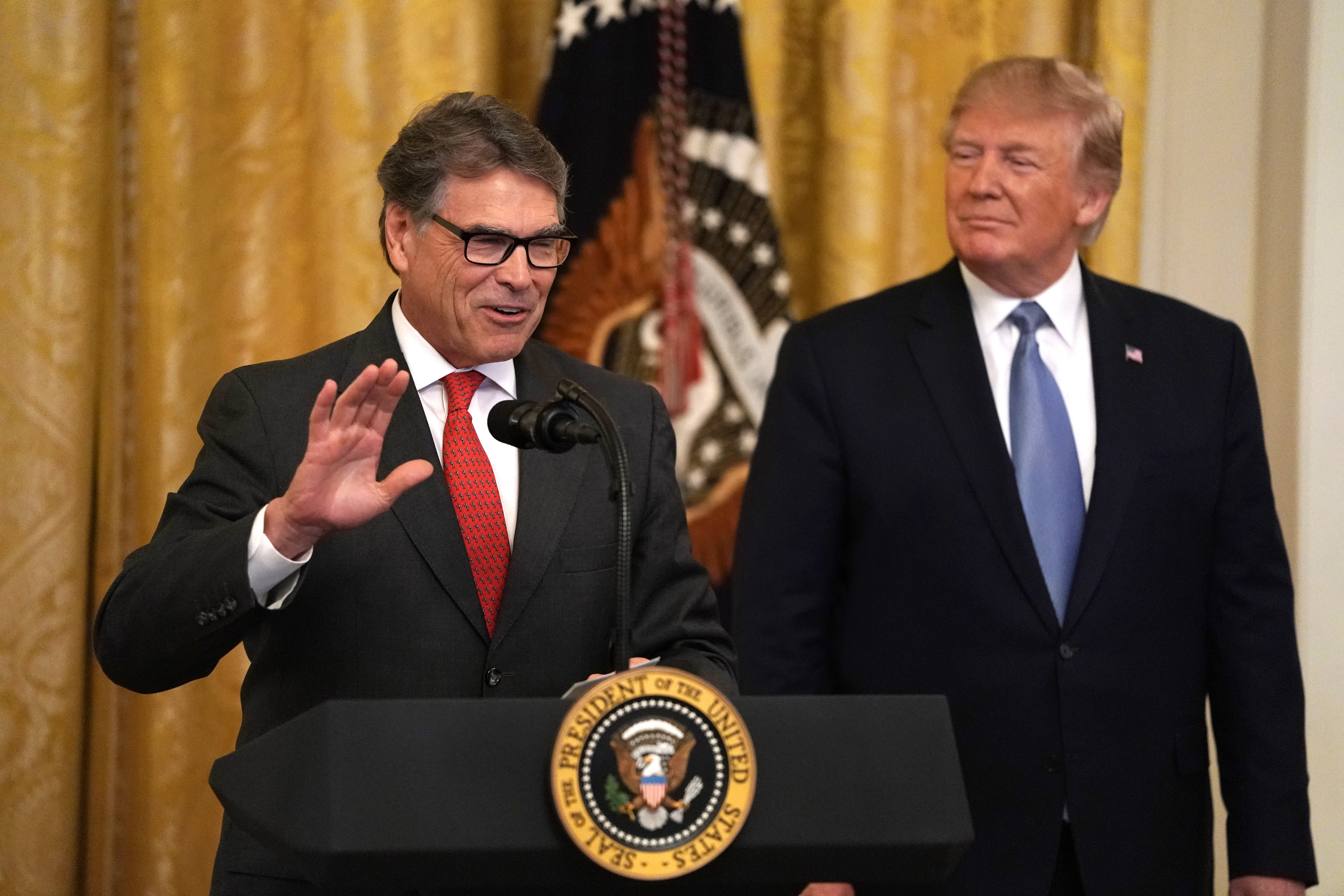 U.S. Secretary of Energy Rick Perry speaks as President Donald Trump looks on during an East Room event on the environment, July 7, 2019, at the White House in Washington, D.C. (Credit: Alex Wong/Getty Images)