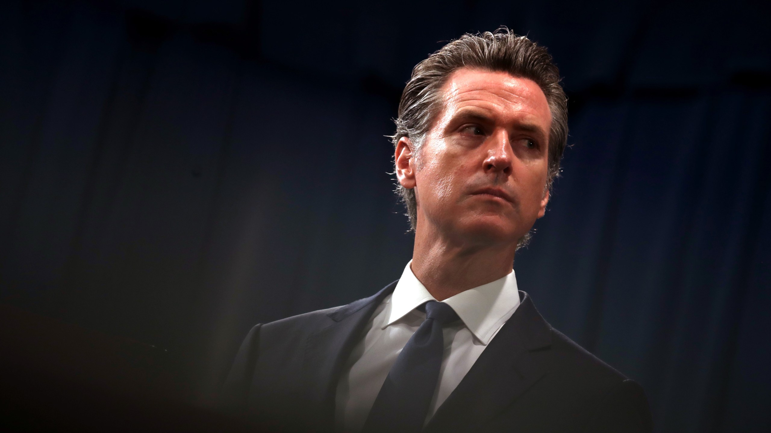 California Gov. Gavin Newsom looks on during a news conference with California attorney General Xavier Becerra at the California State Capitol on August 16, 2019 in Sacramento, California. (Credit: Justin Sullivan/Getty Images)