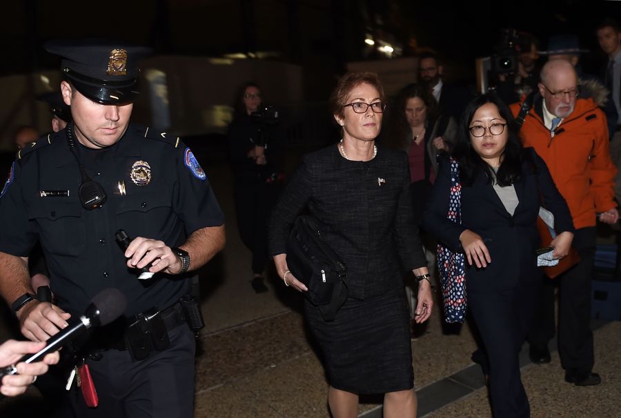 Former U.S. Ambassador to Ukraine Marie Yovanovitch (C) flanked by lawyers, aides and Capitol police, leaves the US Capitol Oct. 11, 2019, in Washington, D.C., after testifying behind closed doors to the House Intelligence, Foreign Affairs and Oversight committees as part of the ongoing impeachment investigation against President Donald Trump. (Credit: OLIVIER DOULIERY/AFP via Getty Images)