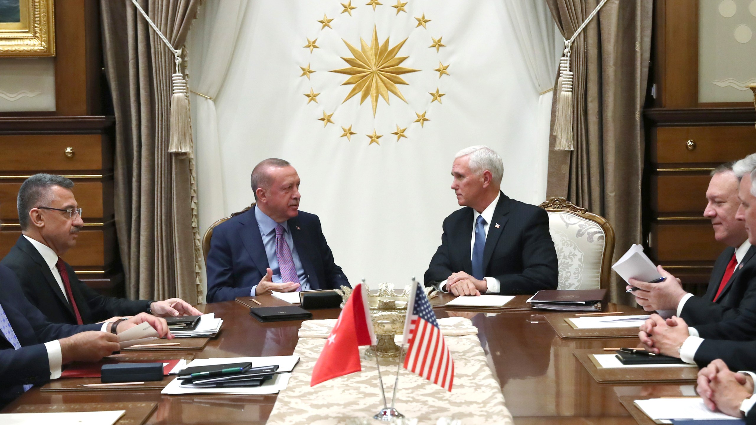 In this handout image provided by the Turkish presidency, Turkish President Recep Tayyip Erdogan meets with U.S. Vice President Mike Pence and Secretary of State Mike Pompeo at Presidential Complex in Ankara, Turkey on Oct. 17, 2019. (Credit: Murat Kula/Turkish Presidency via Getty Images)