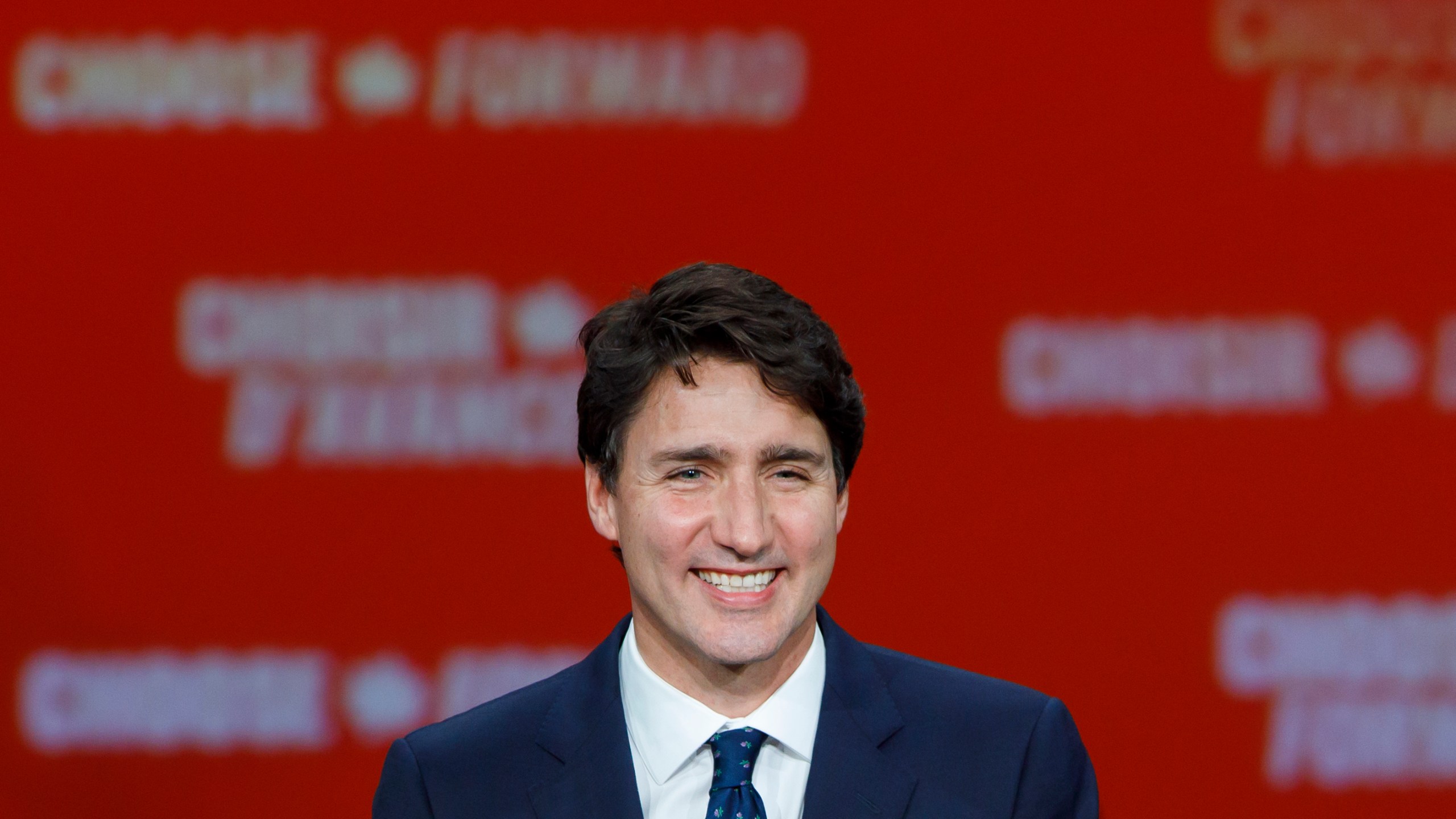 Prime Minister Justin Trudeau smiles as he delivers his victory speech at his election night headquarters on Oct. 21, 2019 in Montreal, Canada. (Credit: Cole Burston/Getty Images)